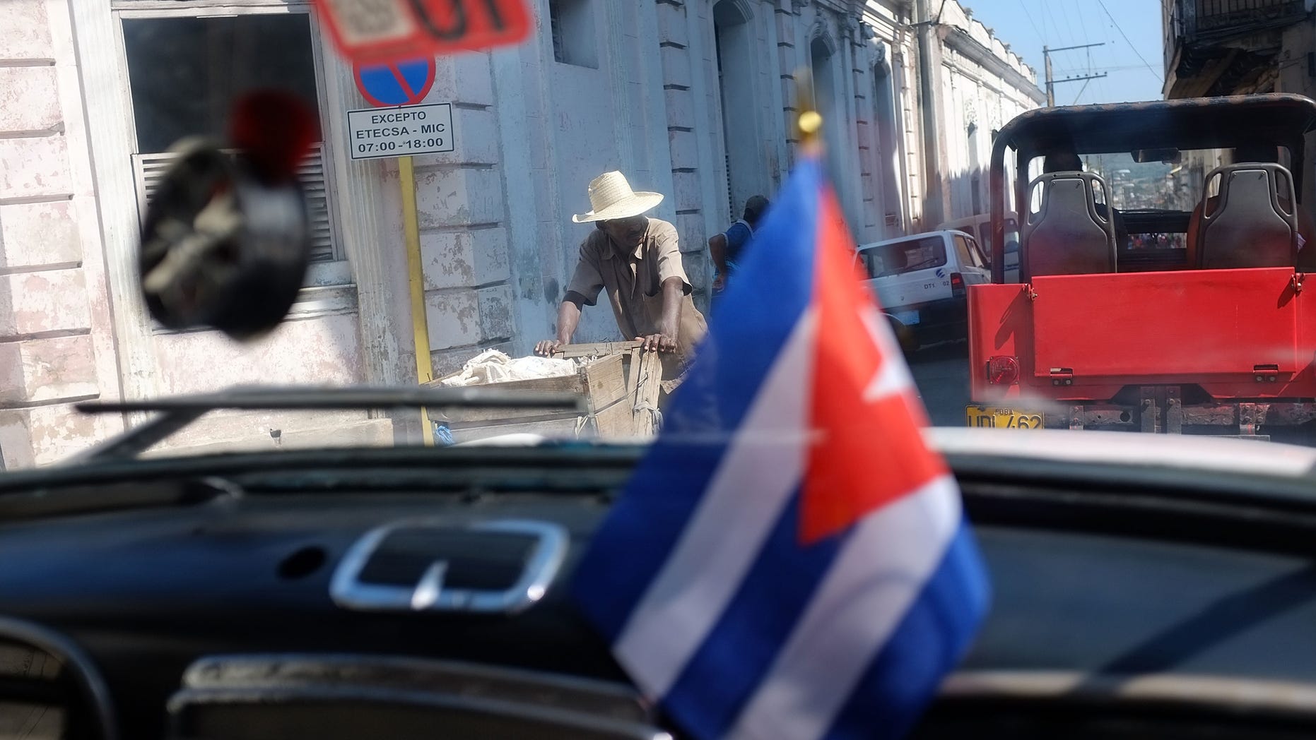 SANTIAGO DE CUBA, CUBA - MARCH 27: A street is seen through a car window a day after Pope Benedict XVI held a historic mass in the city on March 27, 2012 in Santiago de Cuba. Fourteen years after Pope John Paul II visited Cuba, Pope Benedict is making his first trip to the communist country. Benedict, who arrived from Mexico, conducted a mass in the city of Santiago de Cuba first followed by a mass in Havana before leaving on the 28th. Tensions are high in Cuba between dissidents and the government as activists hope the international exposure of the Papal visit will result in renewed attention to their struggle for greater freedoms. (Photo by Spencer Platt/Getty Images)