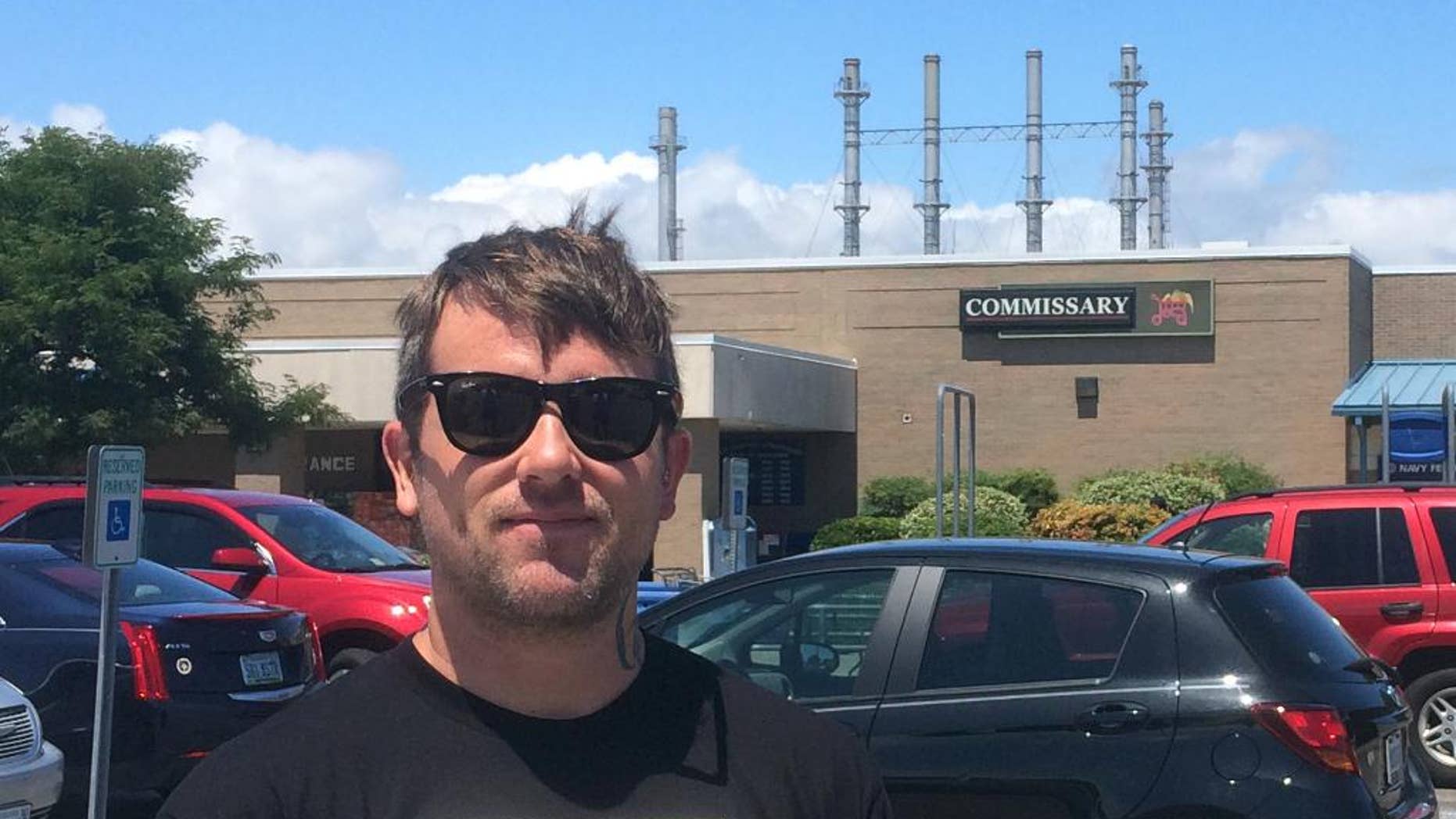 In this Aug. 3, 2016, photo, Jacob Jeske, 28, a commercial diver from Portsmouth, Va., stands outside the Navy Exchange near Naval Station Norfolk, Va. Donald Trump may be losing support from prominent Republicans in the wake of his recent spat with a goldstar family and military icons like John McCain. But many supporters in the home of America's largest Naval base, say they'll still vote for the Republican nominee because too much is at stake, whether it's military funding or picking the next Supreme Court justice. Jeske said Trump's campaign pledge to expand America's military will mean more work for him since he's often hired by private contractors to help maintain Navy ships. (AP Photo/Ben Finley)