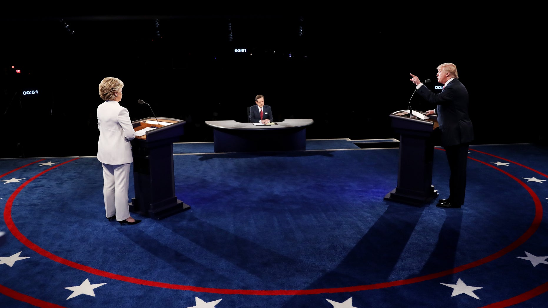 LAS VEGAS, NV - OCTOBER 19: Republican presidential nominee Donald Trump (R) speaks as Democratic presidential nominee former Secretary of State Hillary Clinton looks on during the third U.S. presidential debate at the Thomas & Mack Center on October 19, 2016 in Las Vegas, Nevada. Tonight is the final debate ahead of Election Day on November 8. (Photo by Joe Raedle/Getty Images)