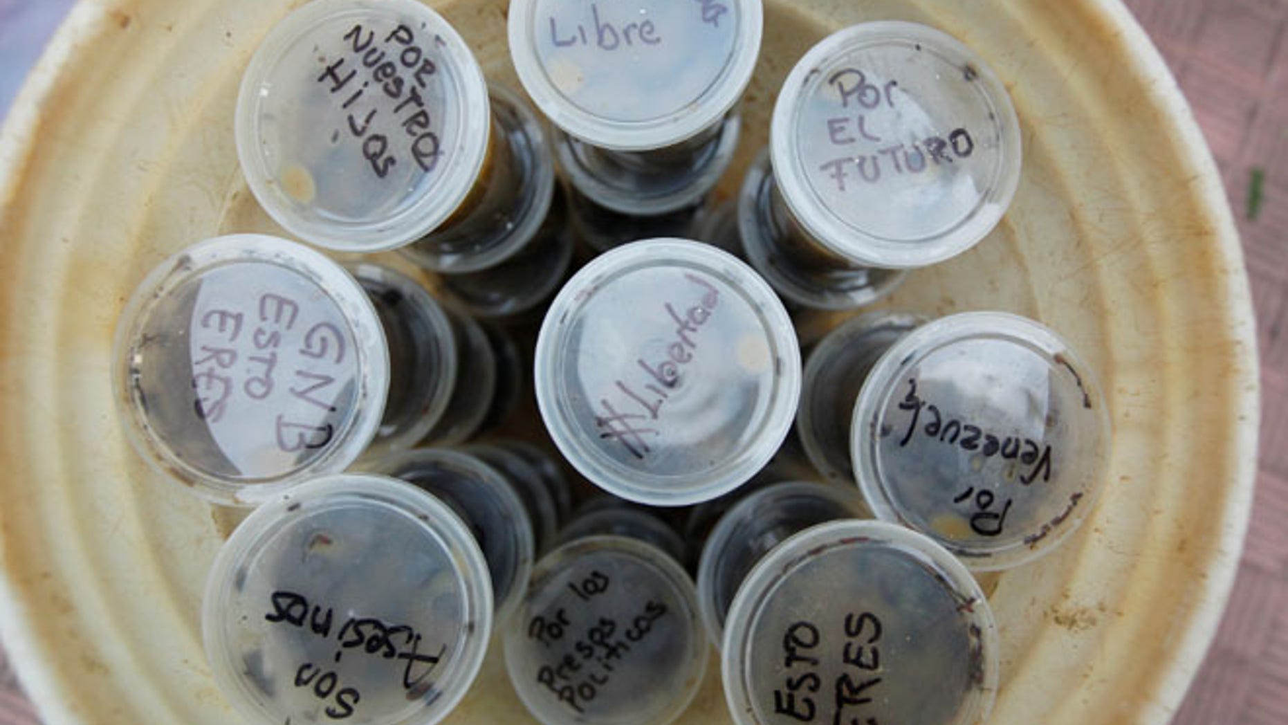 Messages are seen on containers filled with feces.