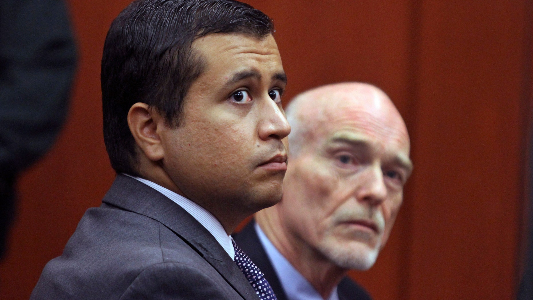 George Zimmerman, left, and attorney Don West at the Seminole County Criminal Justice Center in Sanford, Fla.