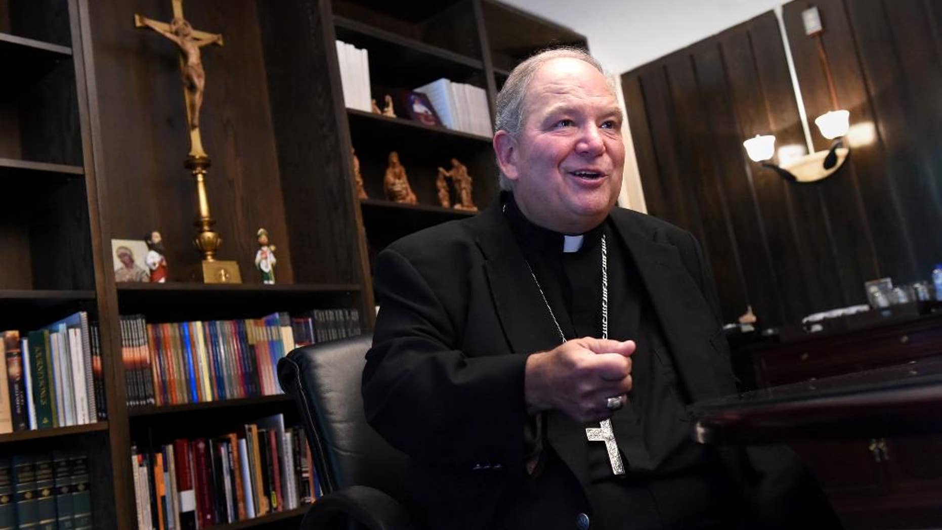 Archbishop Bernard Hebda, interim leader of the Archdiocese of St. Paul and Minneapolis, speaks during an interview in St. Paul, Minn. on Friday, July 10, 2015. Under his predecessor, Archbishop John Nienstedt, the archdiocese was shaken by a clergy sex abuse scandal, criminal charges and bankruptcy. Hebda says he'll collaborate with a wide variety of people on how to formulate a plan to rebuild the archdiocese. He celebrates his first Mass in the archdiocese Sunday at the St. Paul Cathedral. (Jean Pieri/The St. Paul Pioneer Press via AP)