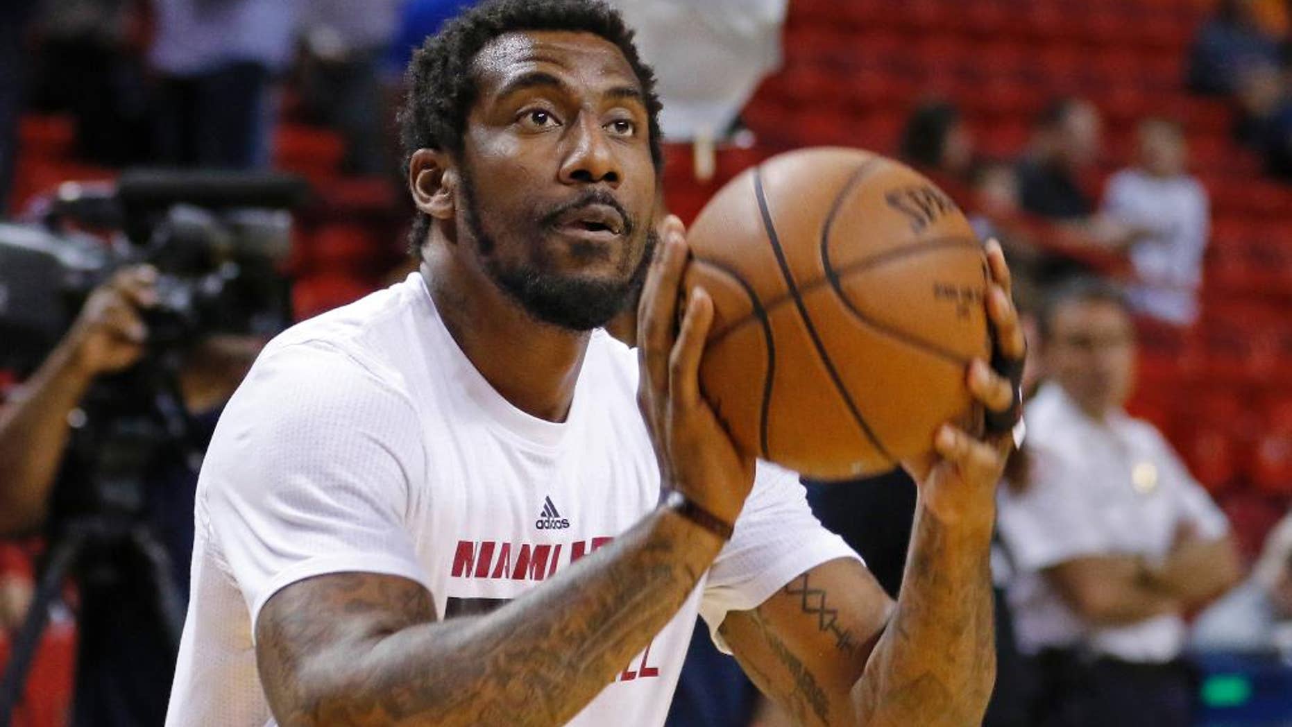 FILE - In this March 28, 2016, file photo, Miami Heat forward Amar'e Stoudemire shoots during warmups before the Heat met the Brooklyn Nets in an NBA basketball game, in Miami. Stoudemire told an Israeli sports website in an article published online on Feb. 28, 2017, that he would avoid a gay teammate. (AP Photo/Joe Skipper, File)