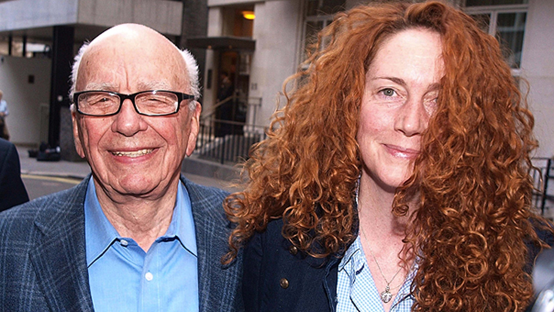 July 10: This photo shows Chairman of News Corporation Rupert Murdoch, left, and Chief executive of News International Rebekah Brooks as they leave his residence in central London.