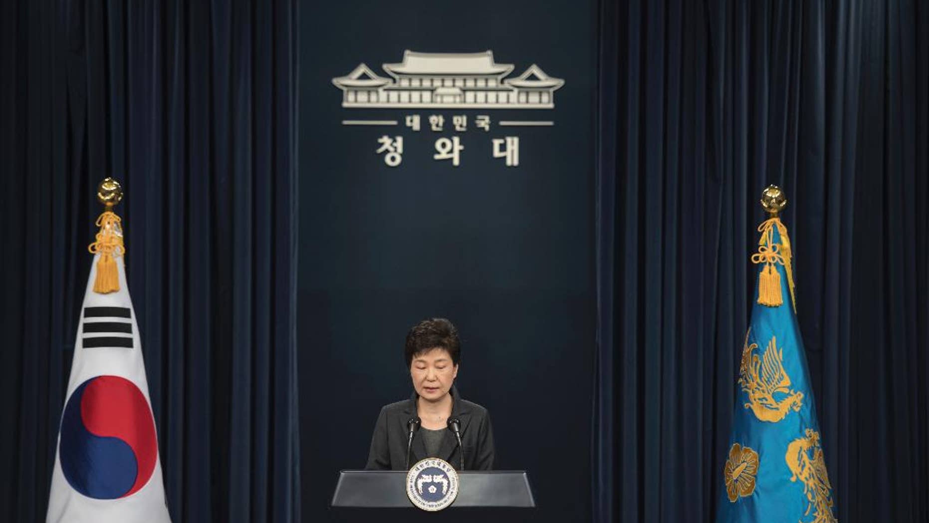 South Korean President Park Geun-hye addresses the nation at the presidential Blue House in Seoul Friday, Nov. 4, 2016. Park took sole blame Friday for a "heartbreaking" scandal that threatens her government and vowed she will accept a direct investigation into her actions amid rising suspicion that she allowed a mysterious confidante to manipulate power from the shadows. (Ed Jones/Pool Photo via AP)