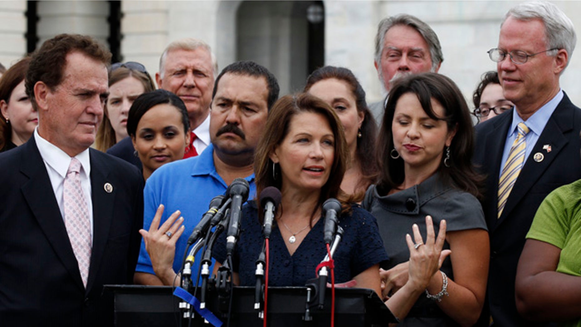 July 21: Tea Party caucus leader Rep. Michele Bachmann, R-Minn., center, speaks at a news conference on Capitol Hill in Washington.