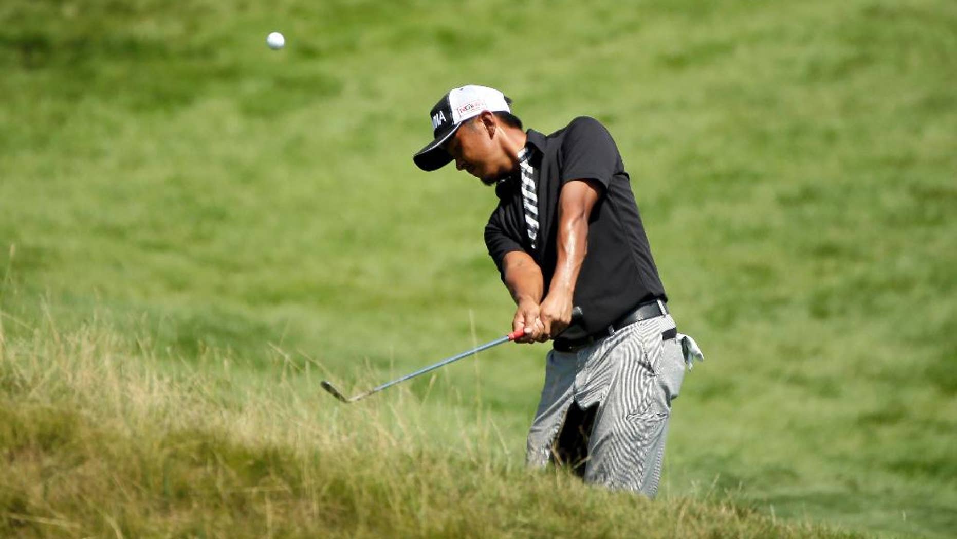 Hiroshi Iwata, of Japan, hits on the 18th hole during the second round of the PGA Championship golf tournament Friday, Aug. 14, 2015, at Whistling Straits in Haven, Wis. (AP Photo/Chris Carlson)