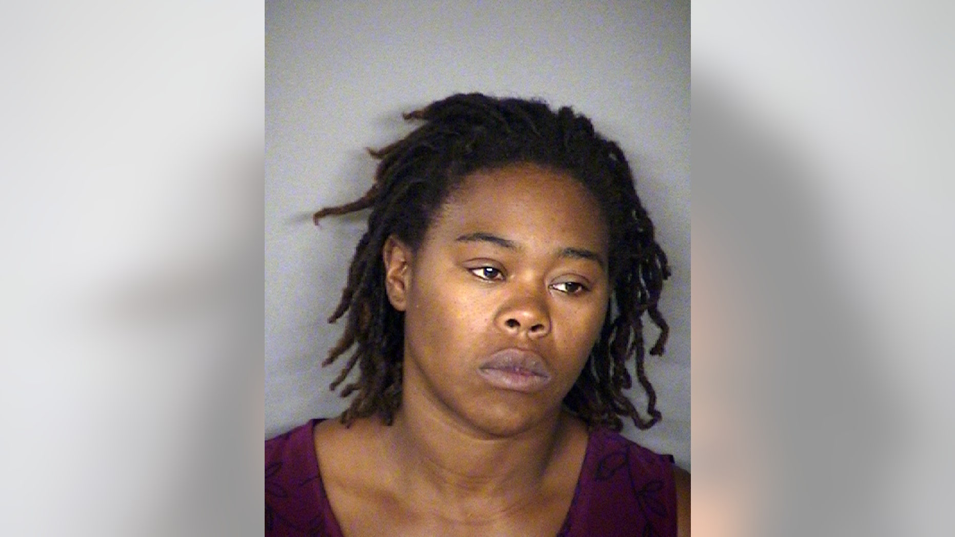 This undated handout photo provided by the Texas Department of Criminal Justice shows Cheryl Reed, the mother of the two young children found chained and leashed outside a San Antonio home, who is charged with two counts of injury to a child. Bexar County sheriff's spokesman James Keith said Friday, May 6, 2016, that the two children, along with six others found inside the home, are in state custody. The six other children showed no signs of physical abuse. (Bexar County Sheriff's Office via AP)