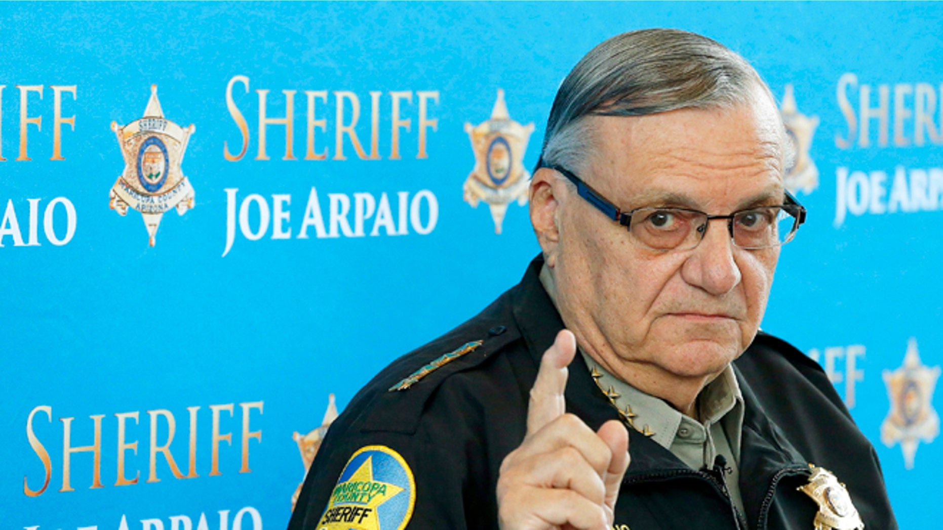 FILE - In this Dec. 18, 2013, file photo, Maricopa County Sheriff Joe Arpaio speaks at a news conference at Maricopa County Sheriff's Office Headquarters in Phoenix. The Arizona sheriff known for clashing with the federal government and cracking down on illegal immigration will face a civil contempt-of-court hearing because his office repeatedly violated orders issued in a racial-profiling case, a U.S. judge said Thursday, Feb. 12, 2015. (AP Photo/Ross D. Franklin, File)