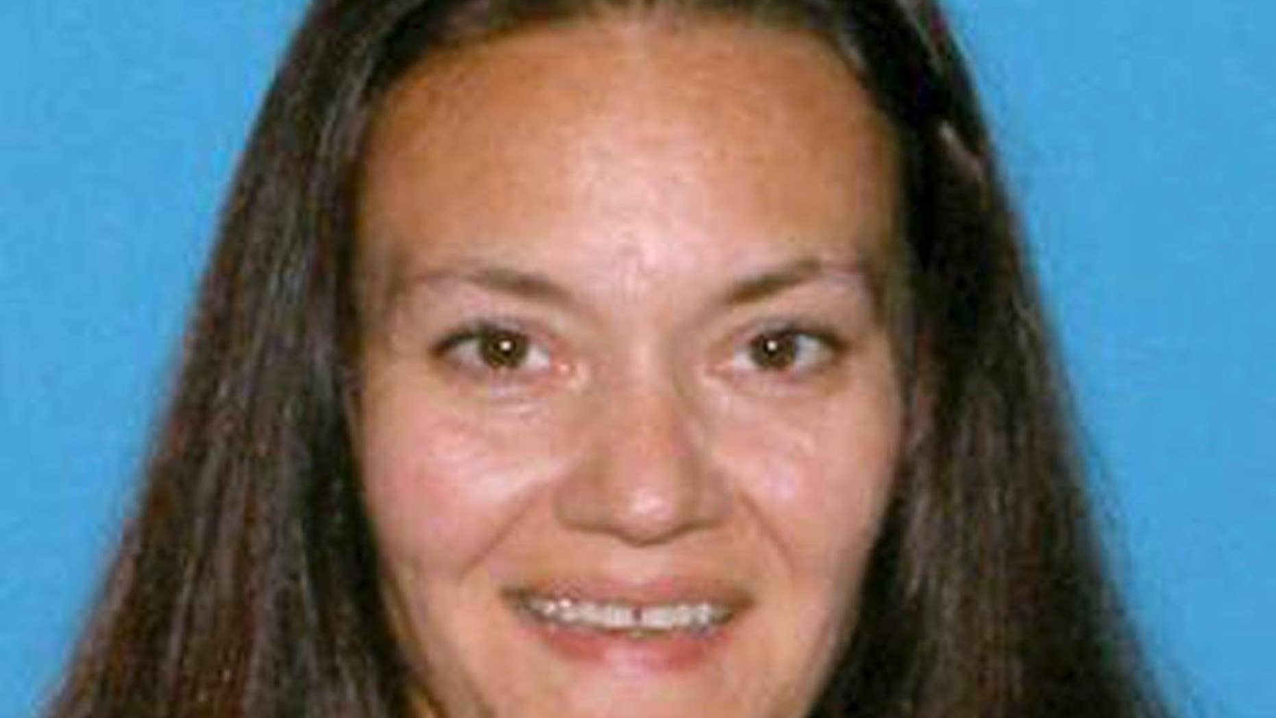 CORRECTS NAME TO RACHELLE FROM RACHEL - This undated identification photo released Friday, Sept. 18, 2015 by the Suffolk County District Attorney's Office shows Rachelle Bond, mother of Bella Bond, the toddler whose body was found in a trash bag on a Boston Harbor beach in June and who was known for months as only Baby Doe. Rachelle Bond was arrested and charged as an accessory to murder after the fact in Bella's death. Her boyfriend, Michael McCarthy, was charged with murder. (Suffolk County District Attorney's Office via AP)