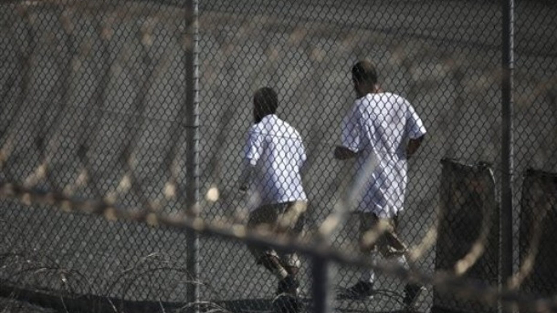 In this photo, reviewed by the U.S. military, Guantanamo detainees jog together inside a recreation area at Camp 6 high-security detention facility at Guantanamo Bay U.S. Naval Base, Cuba, Tuesday, March 30, 2010. (AP)