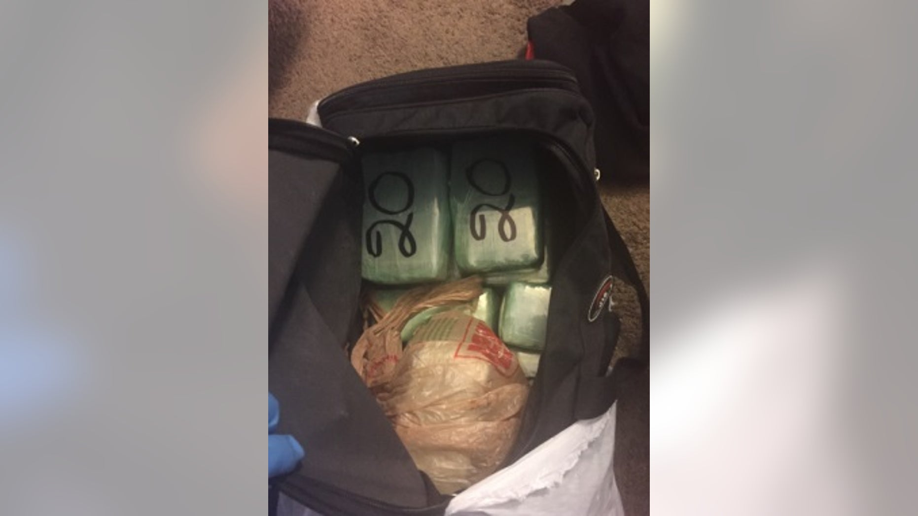 Officers discovered 33 pounds of cocaine inside Hugo Rueda vehicle.