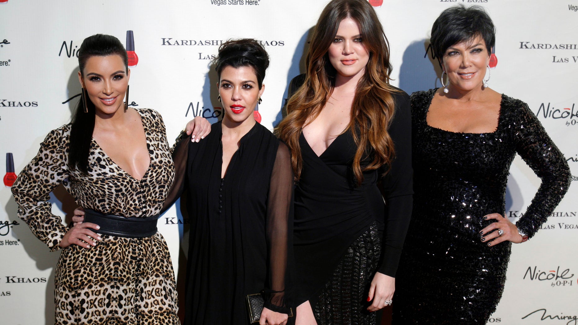 December 15, 2011. Television personalities (L-R) Kim Kardashian, Kourtney Kardashian, Khloe Kardashian and Kris Jenner arrive at the grand opening of the Kardashian Khaos store at the Mirage Hotel and Casino in Las Vegas, Nevada.