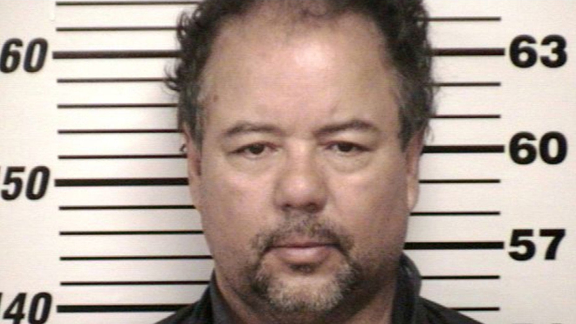 FILE - This undated file photo provided by Cuyahoga County Jail shows Ariel Castro. Cleveland officials are trying to keep Castro's house, where three women were imprisoned for a decade, intact until his trial is concluded. (AP Photo/Cuyahoga County Jail, File)
