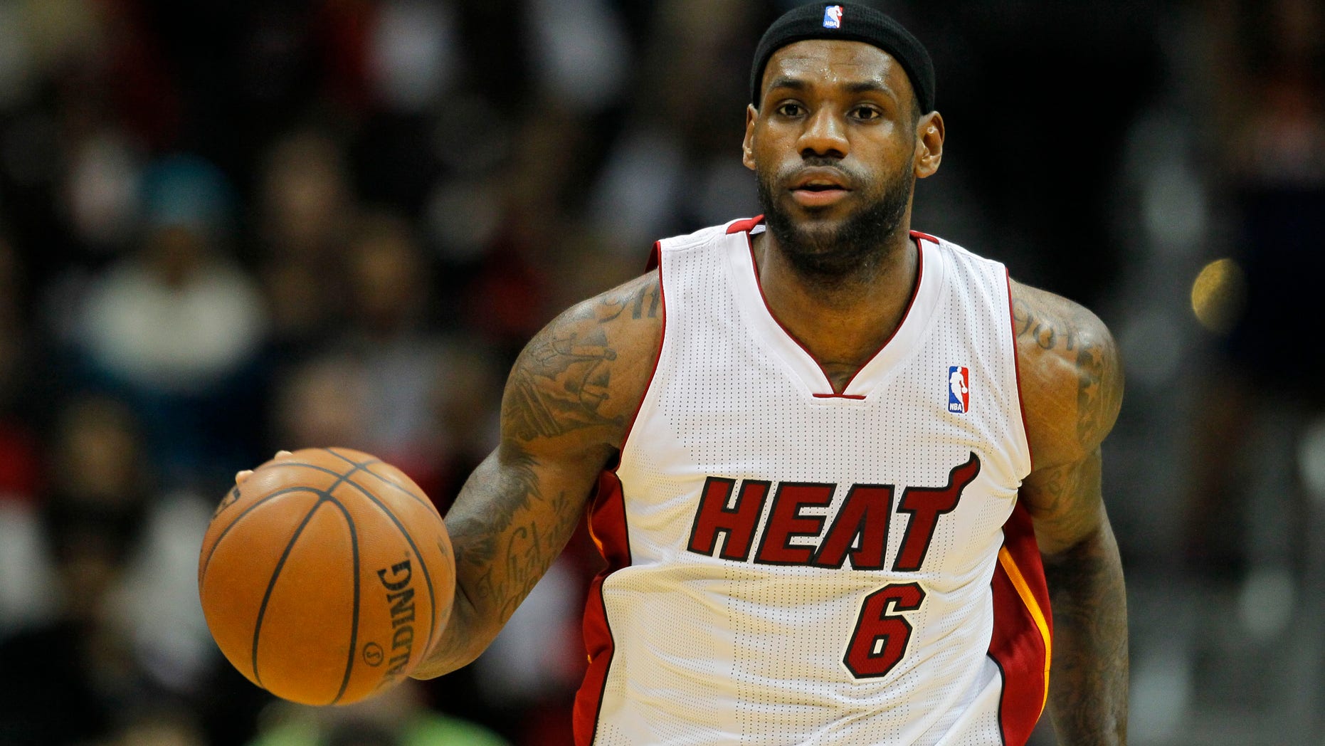 Miami Heat small forward LeBron James (6) drives down the court during the first period of an NBA basketball game against the Atlanta Hawks in Atlanta, Monday, Jan. 20, 2014. (AP Photo/Todd Kirkland)