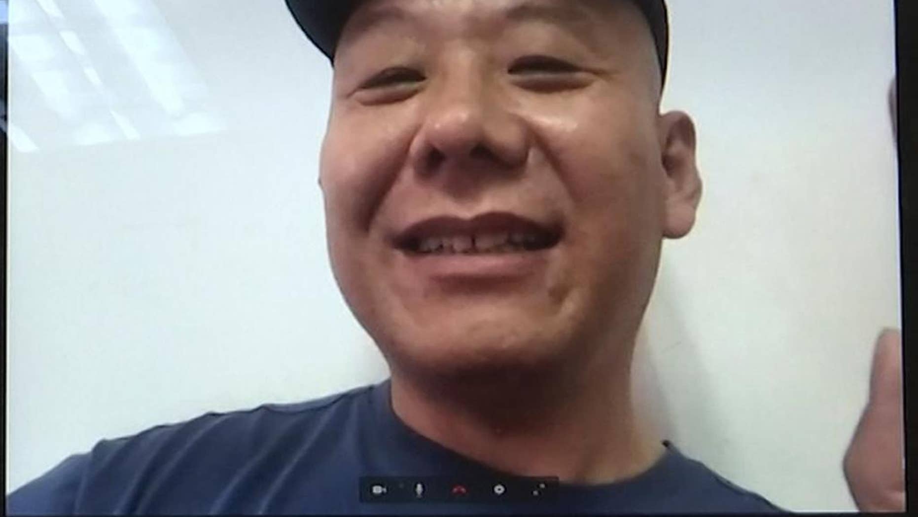 FILE - In this Monday, April 17, 2017, file photo, Chinese dissident Zhang Xiangzhong is seen on a computer screen during an interview via videoconference in Taipei, Taiwan. Taiwan's return Zhang this week is seen by analysts as a possible bid by President Tsai Ing-wen to stabilize relations with Beijing. Officials in Taipei say Chinese national Zhang Xiangzhong lacked legal grounds to stay in Taiwan after breaking away from his tour group on April 13. Analysts say Tsai's administration may be hoping China responds in kind. (AP Photo/Johnson Lai, File)