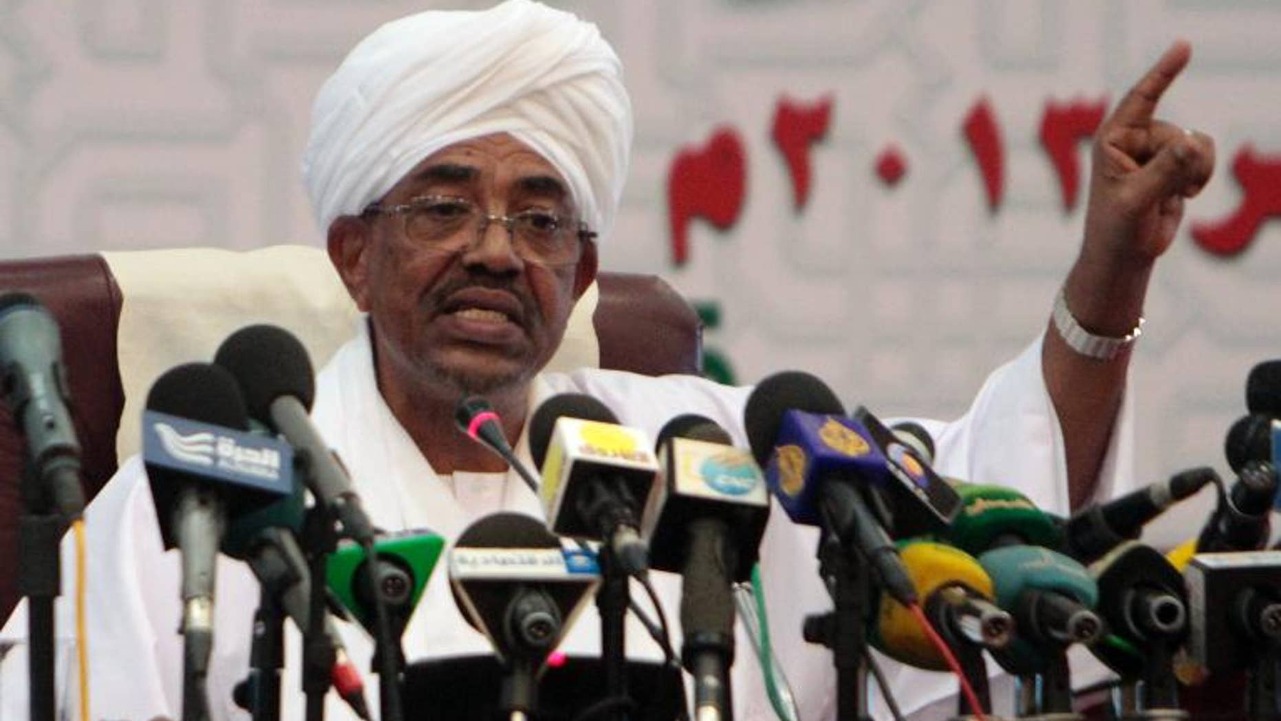 Sudanese President Omar al-Bashir speaks during a press conference in Khartoum on September 22, 2013