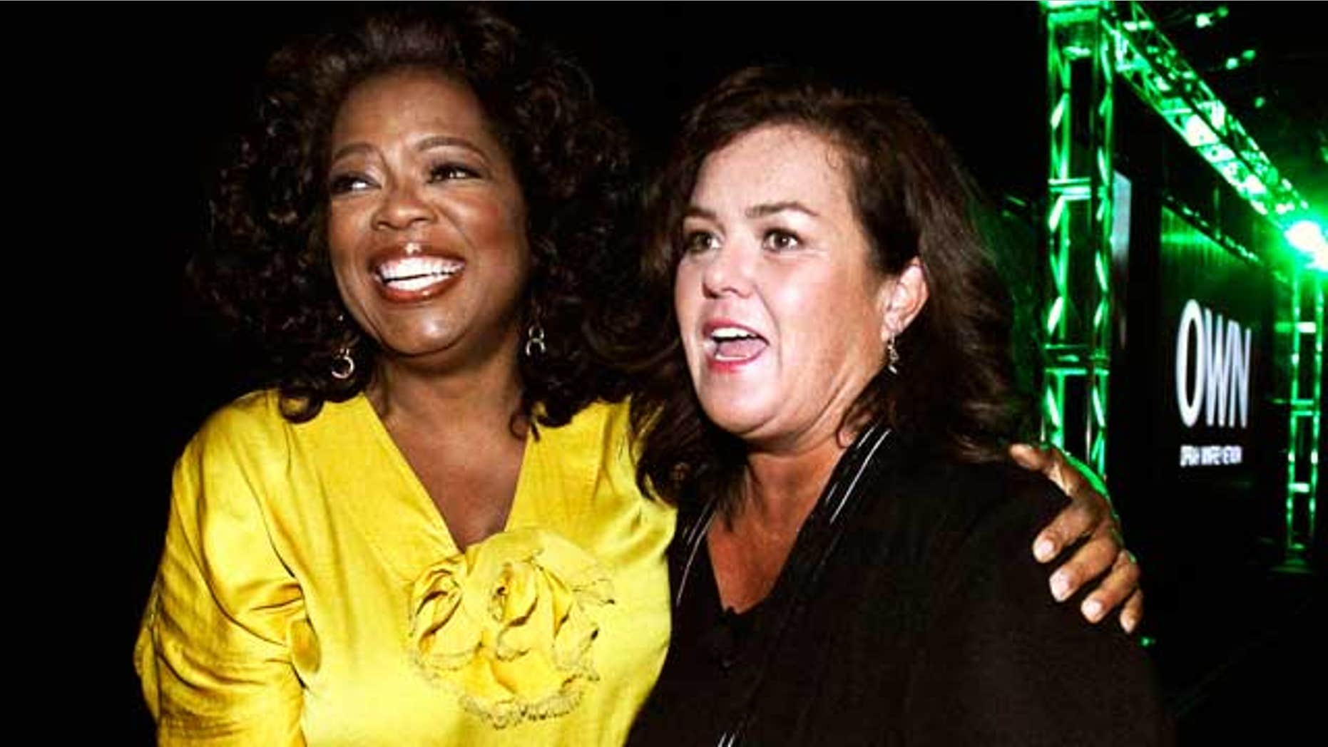 Oprah Winfrey, Chairman, CEO, and Chief Creative Officer of OWN: Oprah Winfrey Network, poses with Rosie O'Donnell at their Television Critics Association presentation on July 29, 2011. (Reuters)