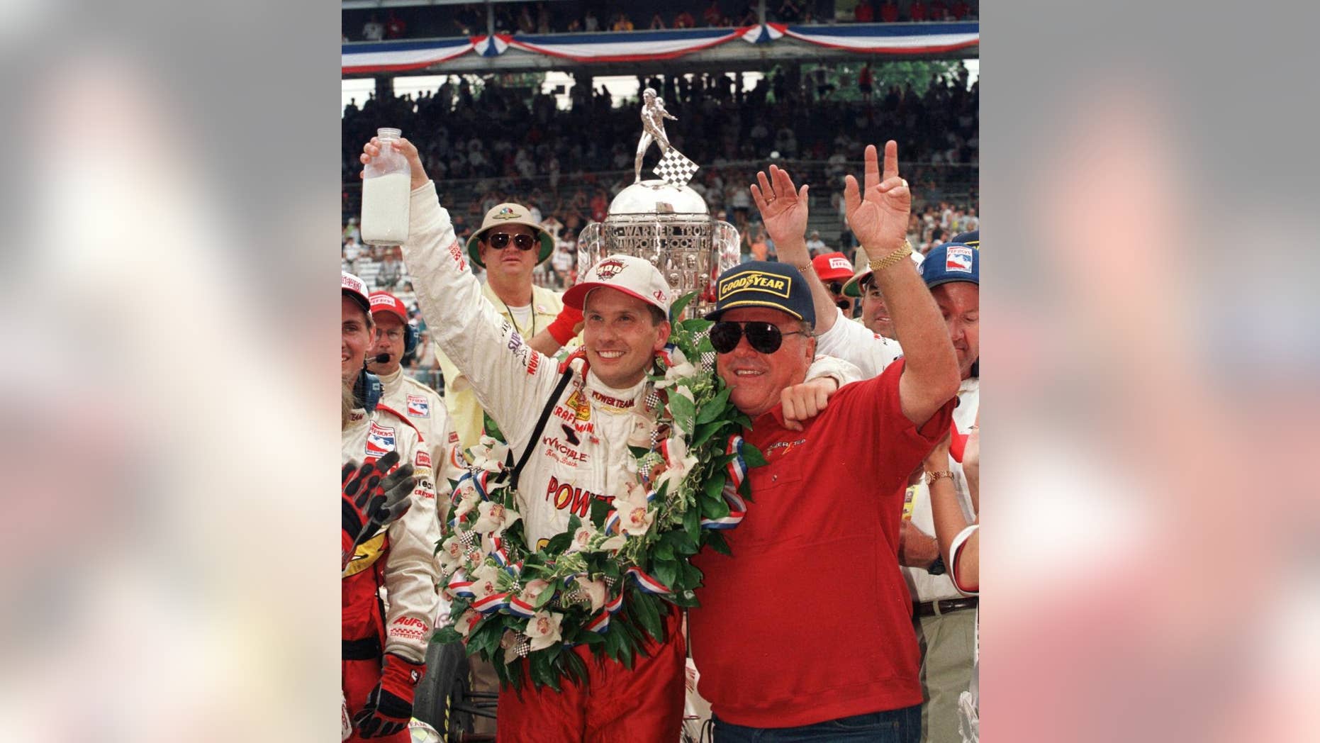 FILE - In this May 30, 1999 file photo, Indianapolis 500 winner Kenny Brack of Sweden, left, and car owner A.J. Foyt of Houston celebrate Brack's win in Victory Lane after the 83rd running of the auto race in Indianapolis. (AP Photo/Al Behrman, File)