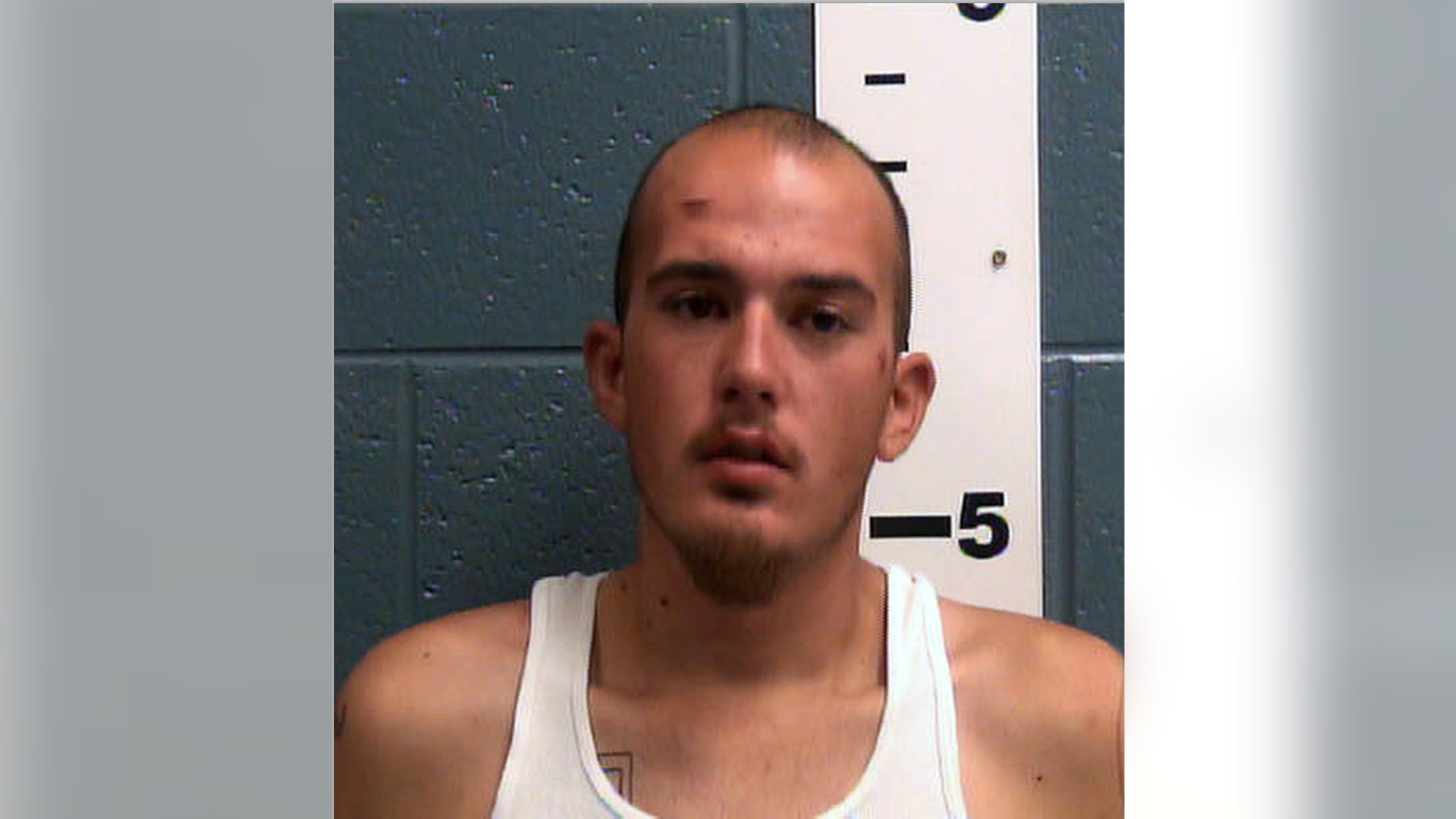 This undated booking photo provided by the Las Cruces Police Department shows Michael Derby. Authorities in southern New Mexico searched Thursday, May 12, 2016, for Derby, a jail inmate who escaped from a medical clinic after he was accused of kidnapping a driver by gunpoint in Texas and twice leading police on car chases. Police in the city of Las Cruces said Derby, is dangerous and urged the public to report tips on his whereabouts after he fled the clinic where he was taken for a medical exam Wednesday night. (Dona Ana County Detention Center/Las Cruces Police Department via AP)