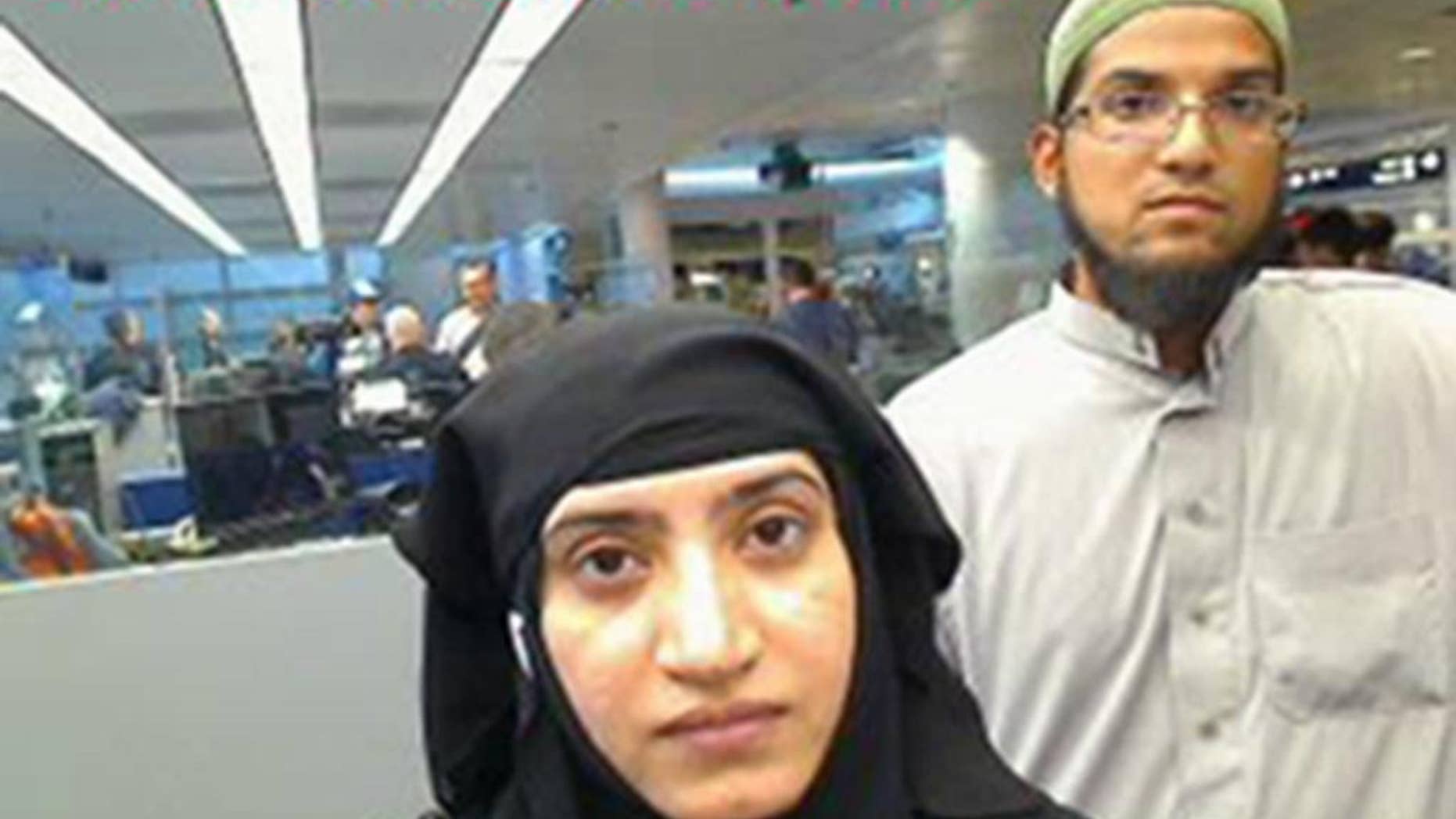 This July 27, 2014 photo provided by U.S. Customs and Border Protection shows Tashfeen Malik, left, and Syed Farook, as they passed through O'Hare International Airport in Chicago. The Obama administration is reviewing procedures for vetting would-be immigrants and its policies on accessing social media. The Homeland Security Department says it is reviewing policies on looking at social media posts to vet would-be immigrants applying for certain visas. (U.S. Customs and Border Protection via AP)