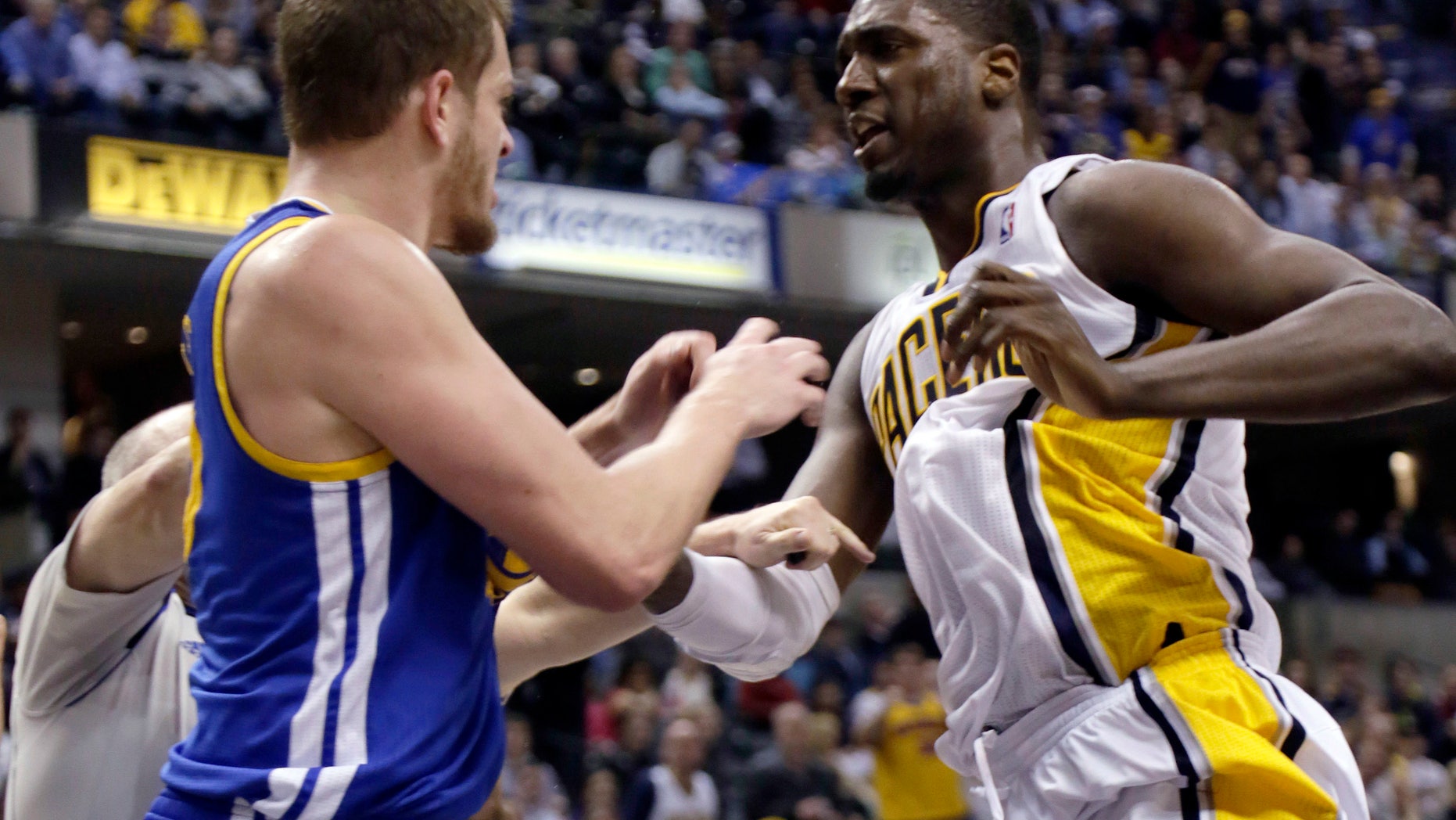 Indiana Pacers center Roy Hibbert, right, skirmishes with Golden State Warriors forward David Lee during the second half of an NBA basketball game in Indianapolis, Tuesday, Feb. 26, 2013. Lee received a technical foul; Hibbert received two technical fouls and was ejected from the game. The Pacers won 108-97. (AP Photo/AJ Mast)