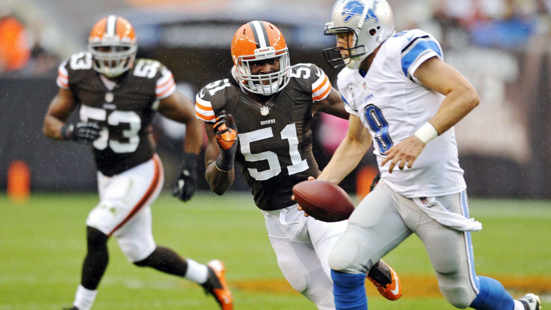 Cleveland Browns linebacker Barkevious Mingo (51) chases Detroit Lions quarterback Matthew Stafford (9) in the second quarter of an NFL football game Sunday, Oct. 13, 2013 in Cleveland. (AP Photo/David Richard)