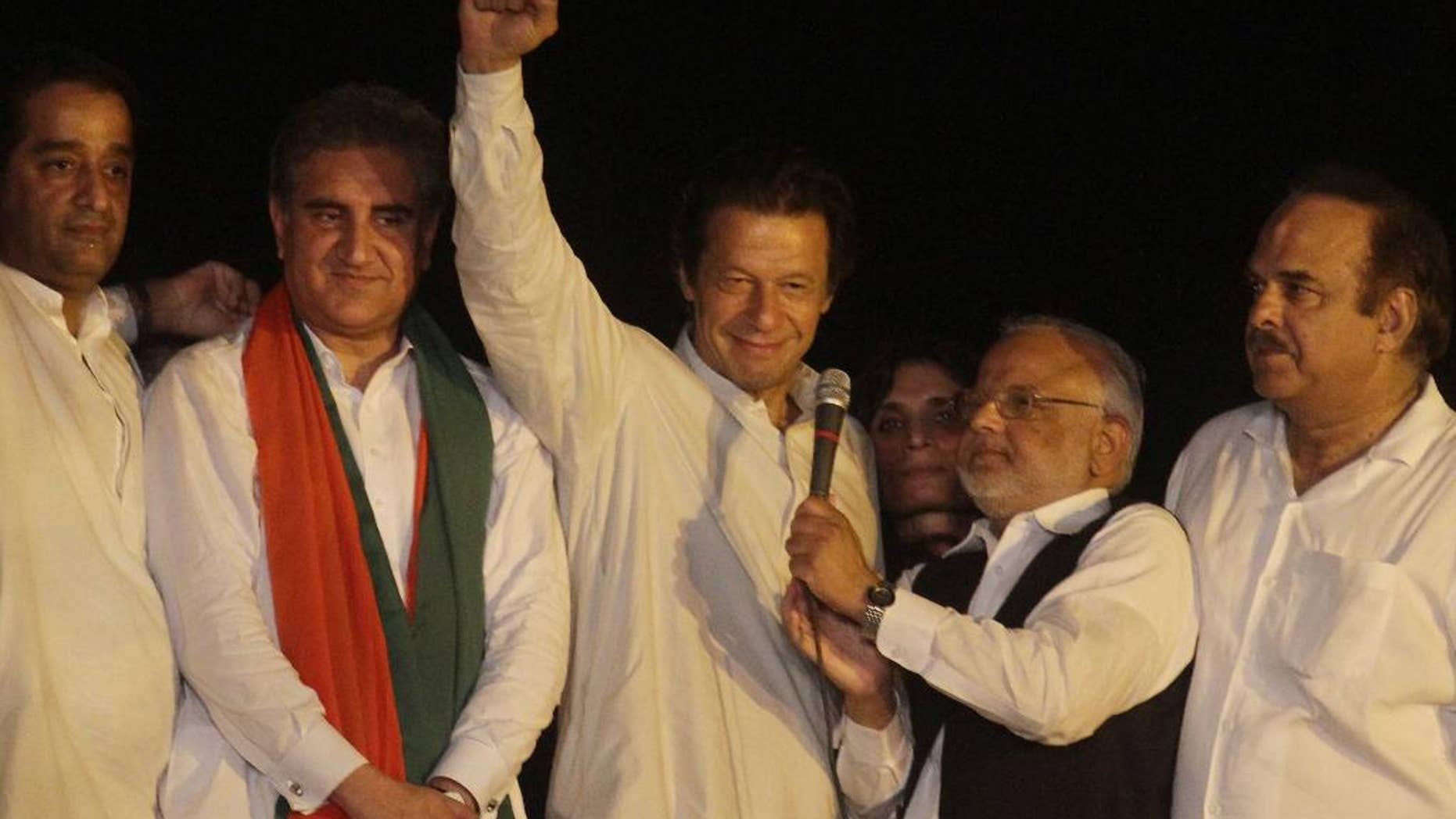 Aug. 13, 2014: Pakistan's cricketer-turned-politician Imran Khan, center, gestures during an address to his supporters in Lahore, Pakistan. (AP)