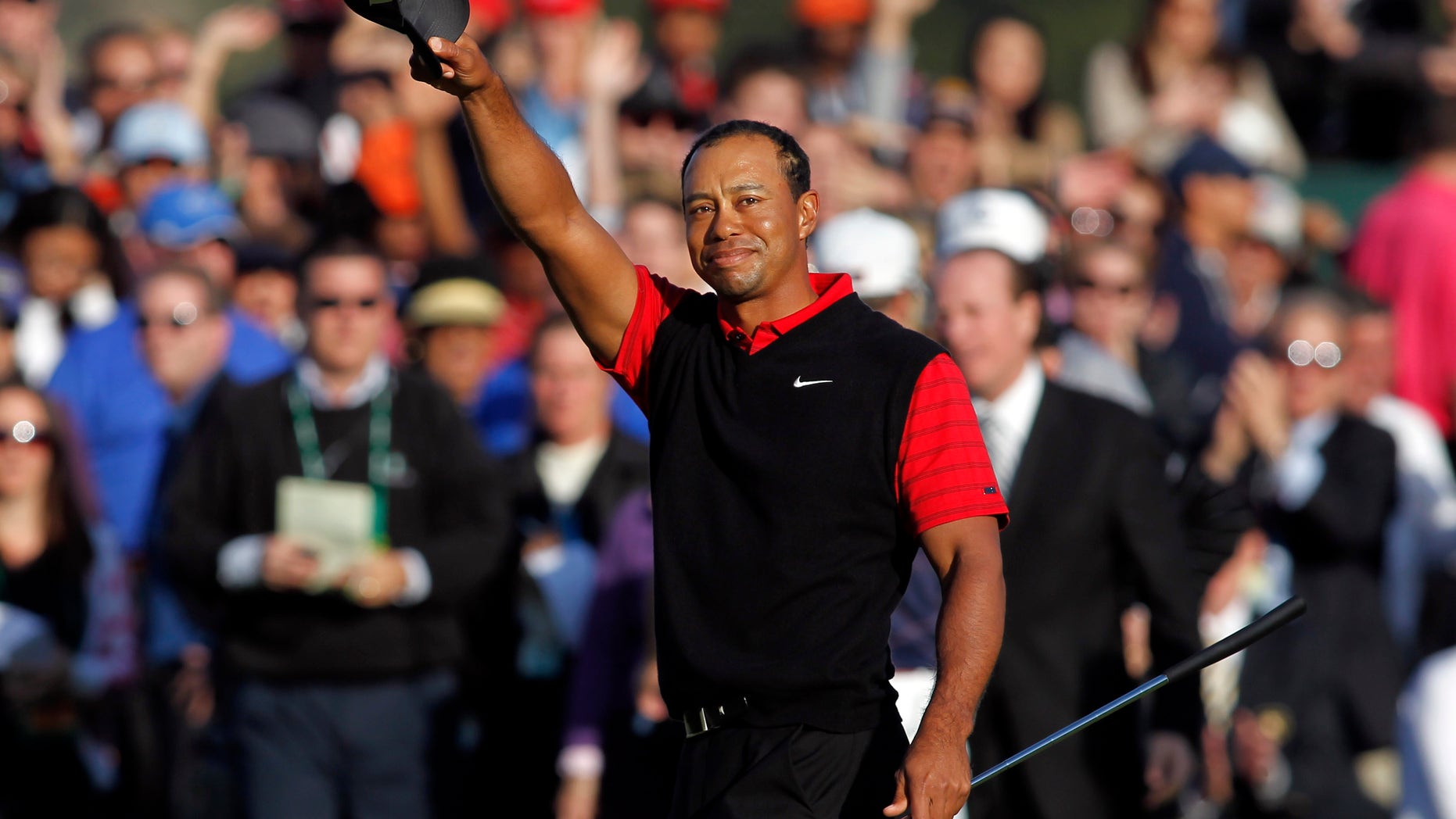 FILE - In this Dec. 4, 2011 file photo, Tiger Woods waves his cap after winning the Chevron World Challenge golf tournament at Sherwood Country Club in Thousand Oaks, Calif. Woods never won what he often referred to as his "hometown event" at Riviera. He made up for it by winning five times at Sherwood Country Club. (AP Photo/Danny Moloshok, File)