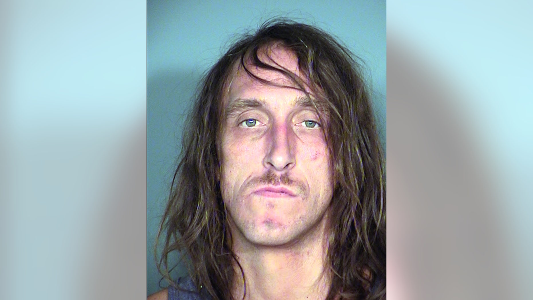 FILE - In this Sept. 11, 2014 booking file photo, provided by Las Vegas Metropolitan Police Department shows Ryan C. Brown, 40, following his arrest on Sept. 10, at the Stratosphere on the Las Vegas Strip. The district attorney in Las Vegas says drug tests weren't complete and criminal charges weren't ready to be filed against Brown who committed suicide after he was accused of crashing his vehicle through the Stratosphere casino doors. District Attorney Steve Wolfson said Friday, Sept. 19, that without blood test results, there wasn't enough evidence to charge Brown or ask a judge to keep him in jail. (AP Photo/Las Vegas Metropolitan Police Department, File)