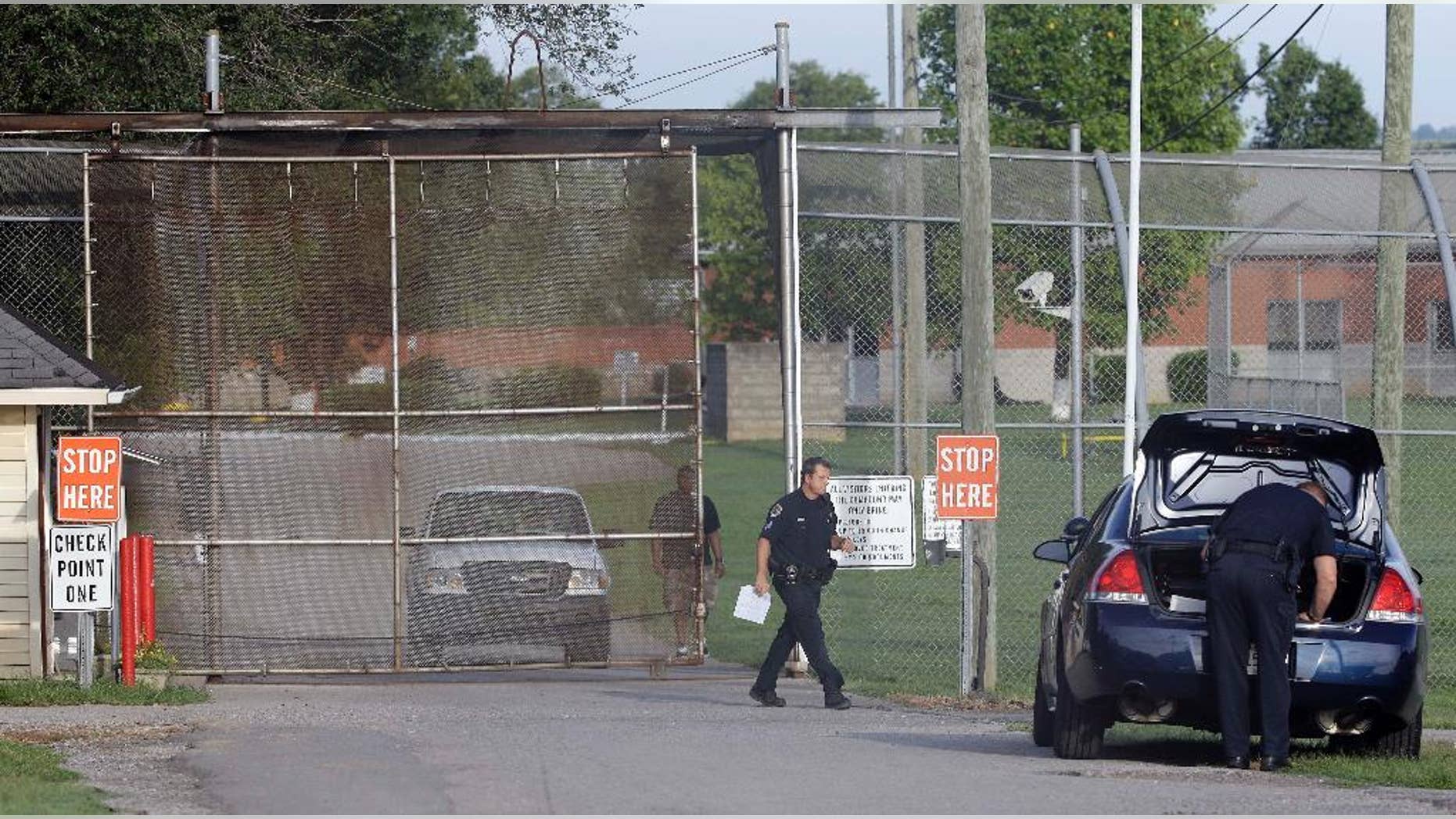 FILE - In this Sept. 2, 2014 file photo, police work in front of the Woodland Hills Youth Development Center in Nashville, Tenn. Thirteen teenagers escaped overnight from the youth detention center in Nashville but all but one were recaptured within hours, authorities said Saturday, Sept. 27, 2014, marking the latest of a rash of security breaches involving the Woodland Hills Youth Development Center. (AP Photo/Mark Humphrey)