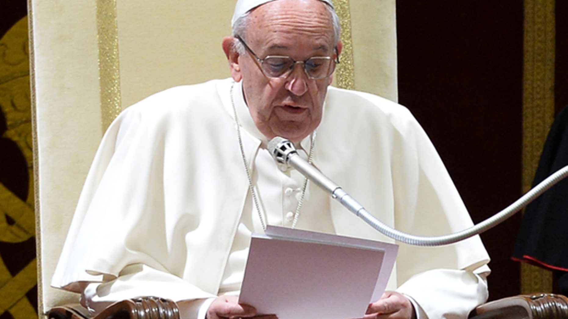 Pope Francis delivers his message during the annual Christmas greetings to the Vatican bureaucracy in the Clementina Hall, at the Vatican, Monday, Dec. 21, 2015. Francis has issued a Christmas-time "catalogue of virtues" for his closest collaborators to follow after having excoriated them last year for a host of sins that he said were compromising the Catholic Church's work. (Alberto Pizzoli/Pool Photo via AP)