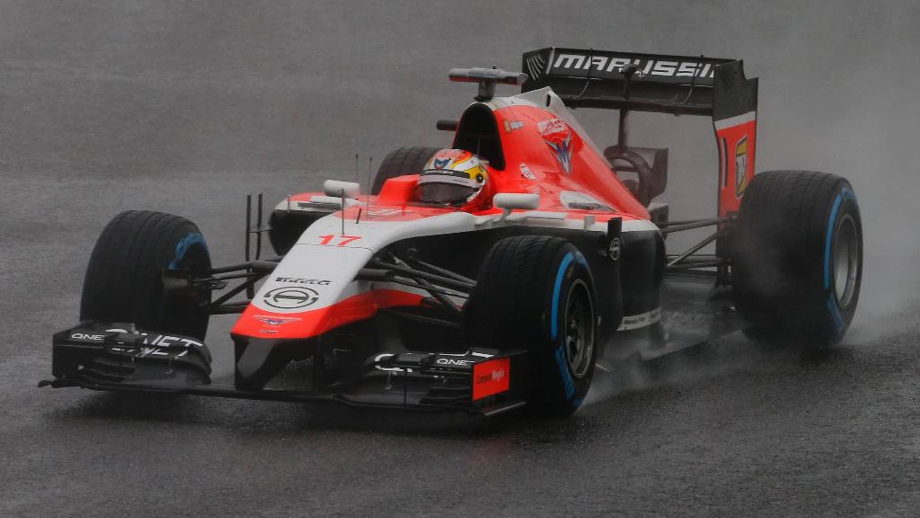 Marussia driver Jules Bianchi of France steers his car during the Japanese Formula One Grand Prix at the Suzuka Circuit in Suzuka, central Japan, Sunday, Oct. 5, 2014. Bianchi has been taken to hospital and is unconscious following a crash during the Japanese Grand Prix. (AP Photo/Shuji Kajiyama)