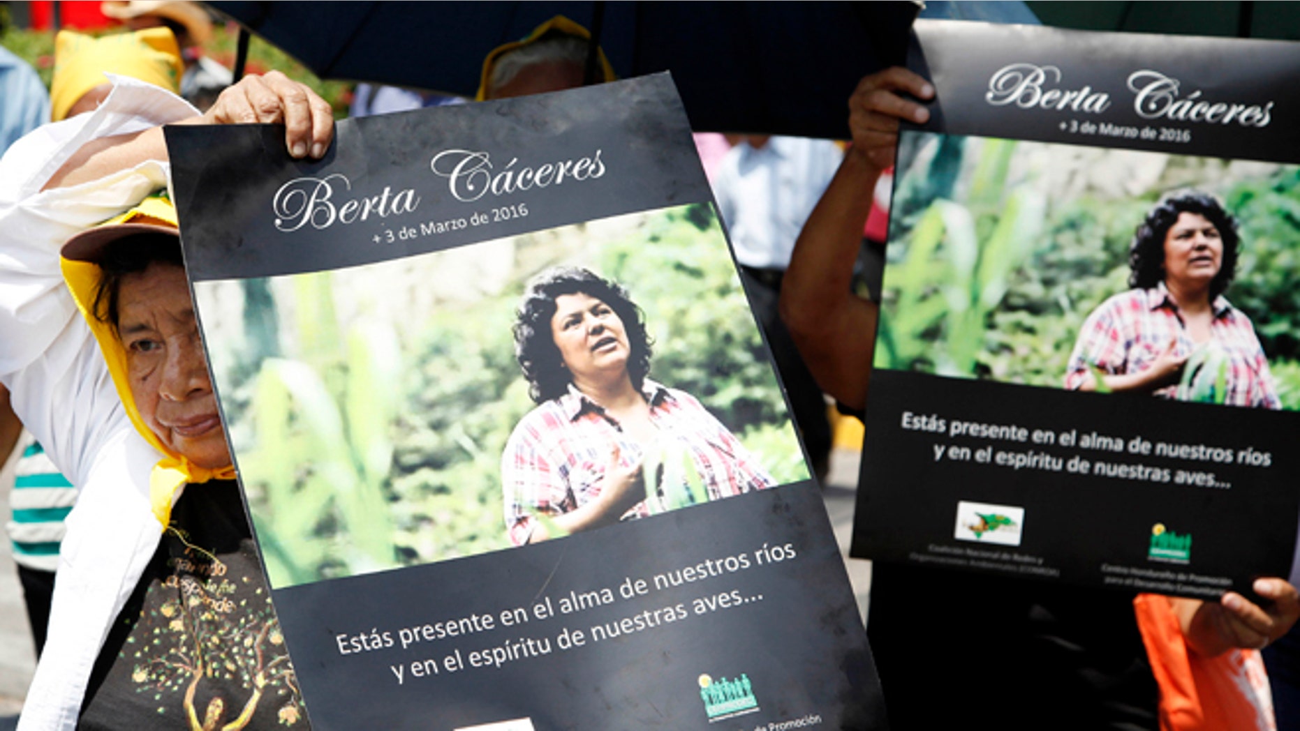 Women hold up posters with a photo of slain environmental leader Berta Caceres during a protest march in Tegucigalpa, Honduras, Wednesday, March 16, 2016. Authorities said that unidentified gunmen killed Nelson Garcia, a colleague of Caceres, who was slain almost two weeks ago in similar circumstances. The organization that both Caceres and Garcia belonged to is describing Garciaâs death as part of âthe governmentâs constant harassmentâ of Indian groups. Both activists were Lenca Indians and belonged to the Indian Council of People's Organizations of Honduras. (AP Photo/Fernando Antonio)