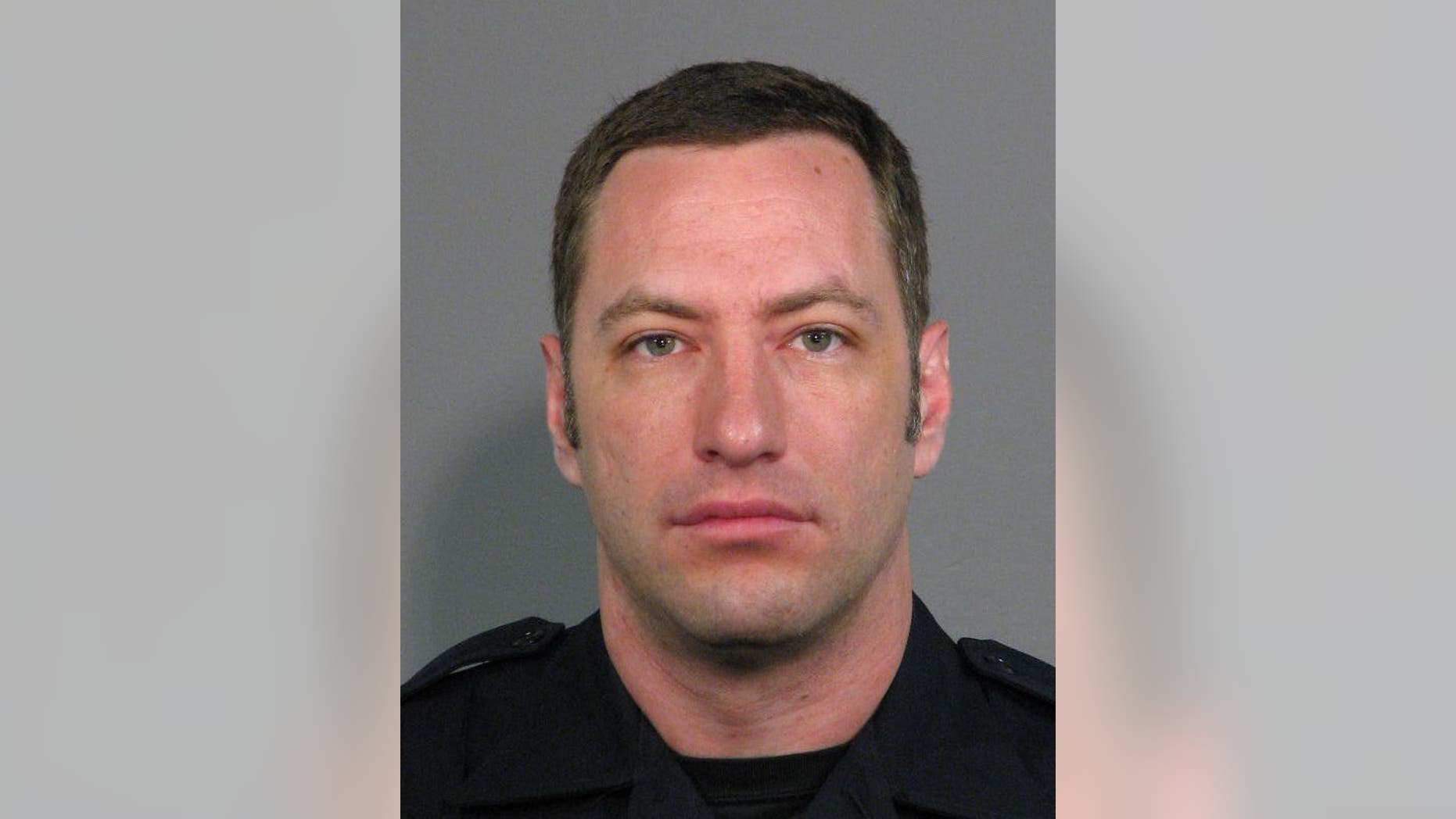 This undated photo provided by the San Jose Police Department shows San Jose Police Officer Michael Johnson. Johnson was fatally shot by Scott Dunham on Tuesday, March 24, 2015, launching an hourslong manhunt. The search ended when Dunham was found dead early Wednesday on his apartment balcony, San Jose police spokesman Albert Morales said. (AP Photo/San Jose Police Department)