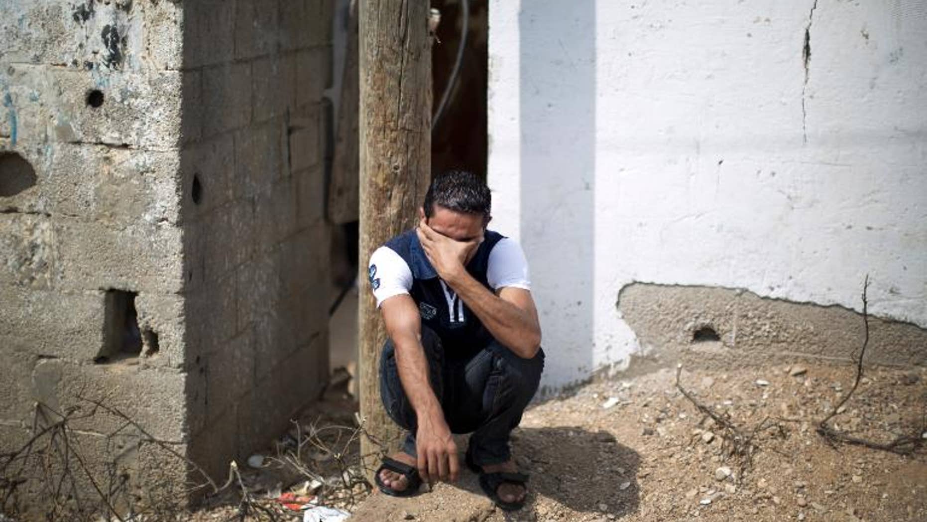 A relative of Palestinian Huweshil Abu Huweshil mourns during his funeral on October 1, 2013