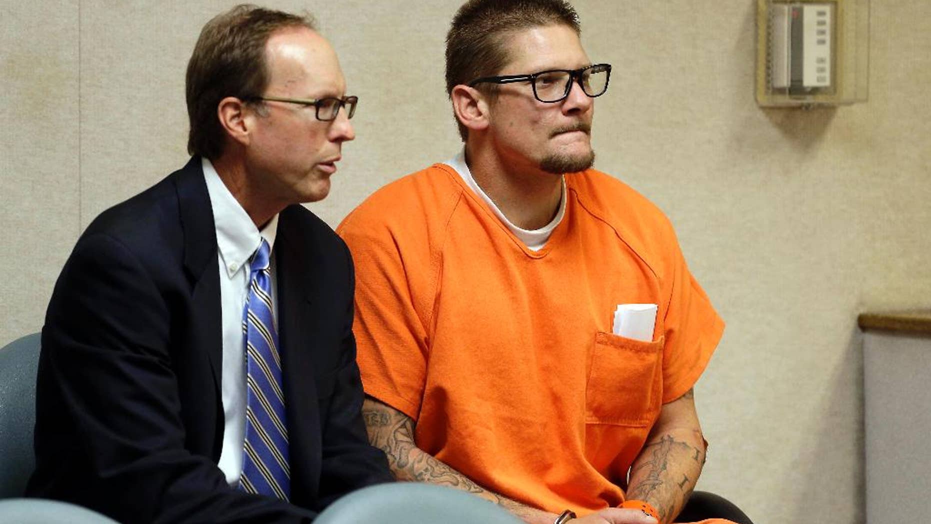 Wayne Allen Huntsman, right, appears in the El Dorado Superior Court with Public Defender William Dittman for charges related to the King Fire, in Placerville, Calif., Friday, Sept. 19, 2014. Huntsman pleaded not guilty to an arson charge. He was being held on $10 million bail after authorities said he started the blaze. (AP Photo/Rich Pedroncelli)