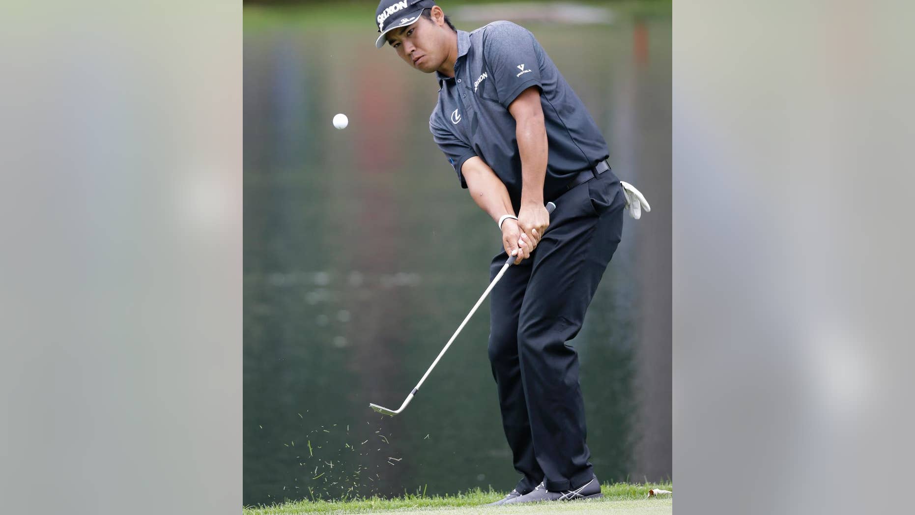 Hideki Matsuyama, from Japan, chips to the third green during the second round of the Bridgestone Invitational golf tournament at Firestone Country Club, Friday, July 1, 2016, in Akron, Ohio. (AP Photo/Tony Dejak)