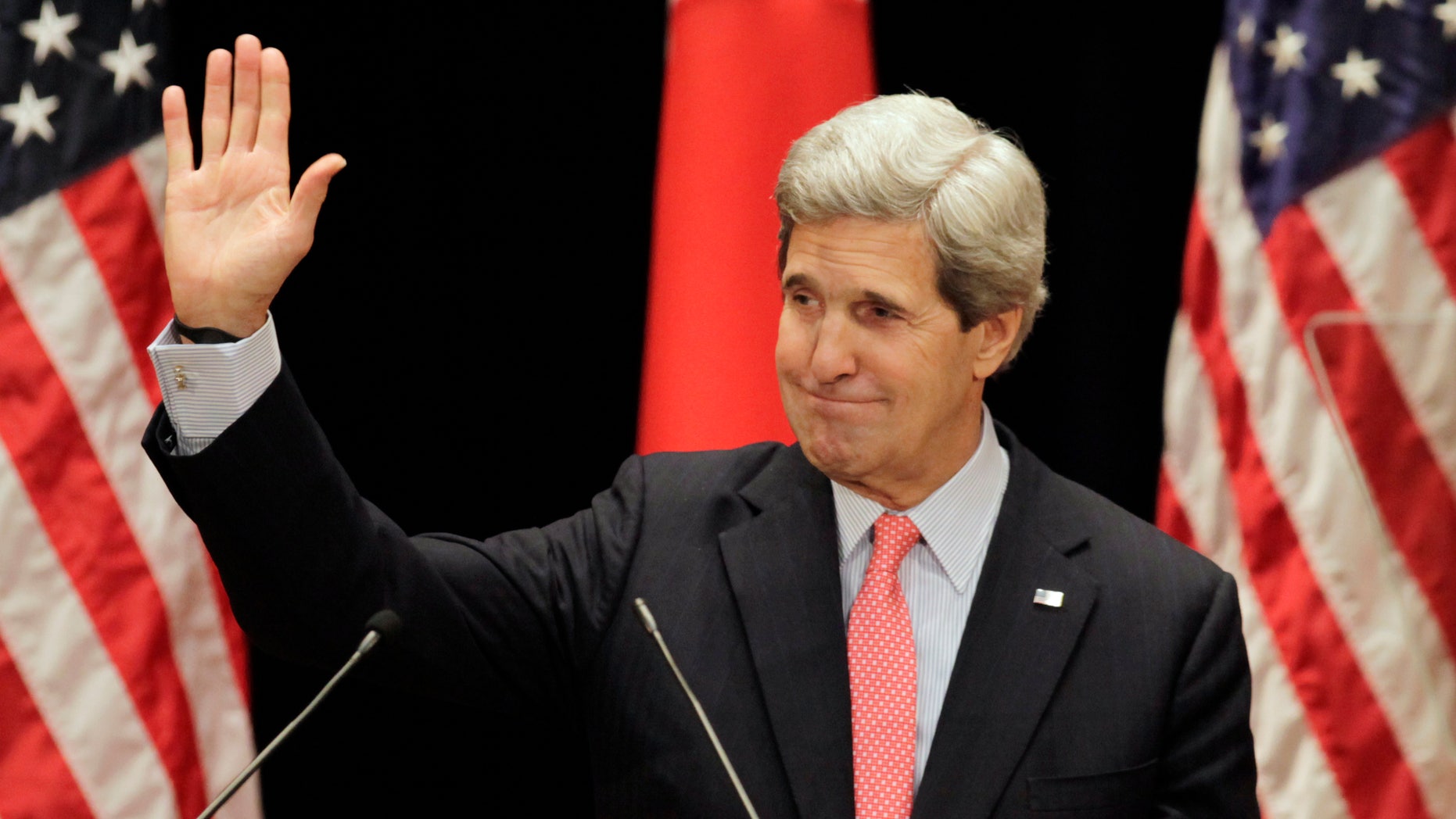 U.S. Secretary of State John Kerry waves after his lecture to students at Tokyo Institute of Technology in Tokyo Monday, April 15, 2013. Kerry is here as part of Asian tour amid a tense situation over a possible missile launch by North Korea. (AP Photo/Junji Kurokawa, Pool)