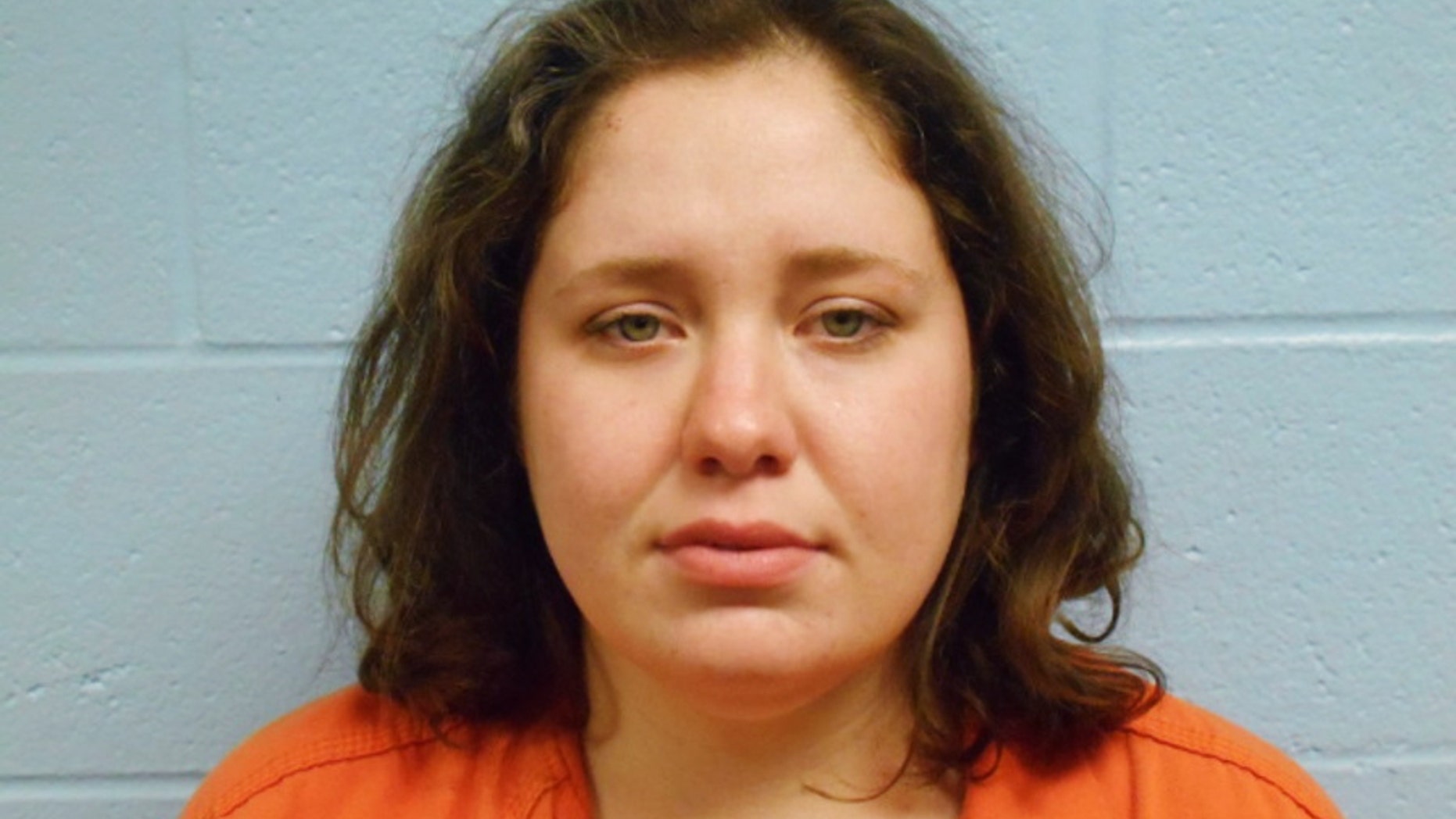 FILE - This file booking photo provided by the Stillwater Police Department shows Adacia Chambers, who is accused of running a red light and purposely driving around a barricade and over a police motorcycle before crashing into spectators at Oklahoma State University's homecoming parade. Chambers has been declared competent to stand trial. (Stillwater Police Department via AP, File)