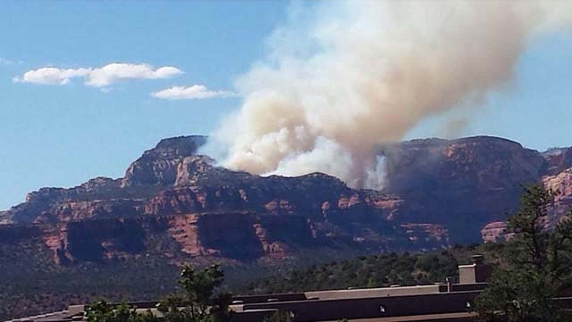July 20, 2014: Smoke from a fire sparked by the crash of a single-engine plane rises over Fay Canyon, near Sedona, Arizona. (MyFoxPhoenix.com)