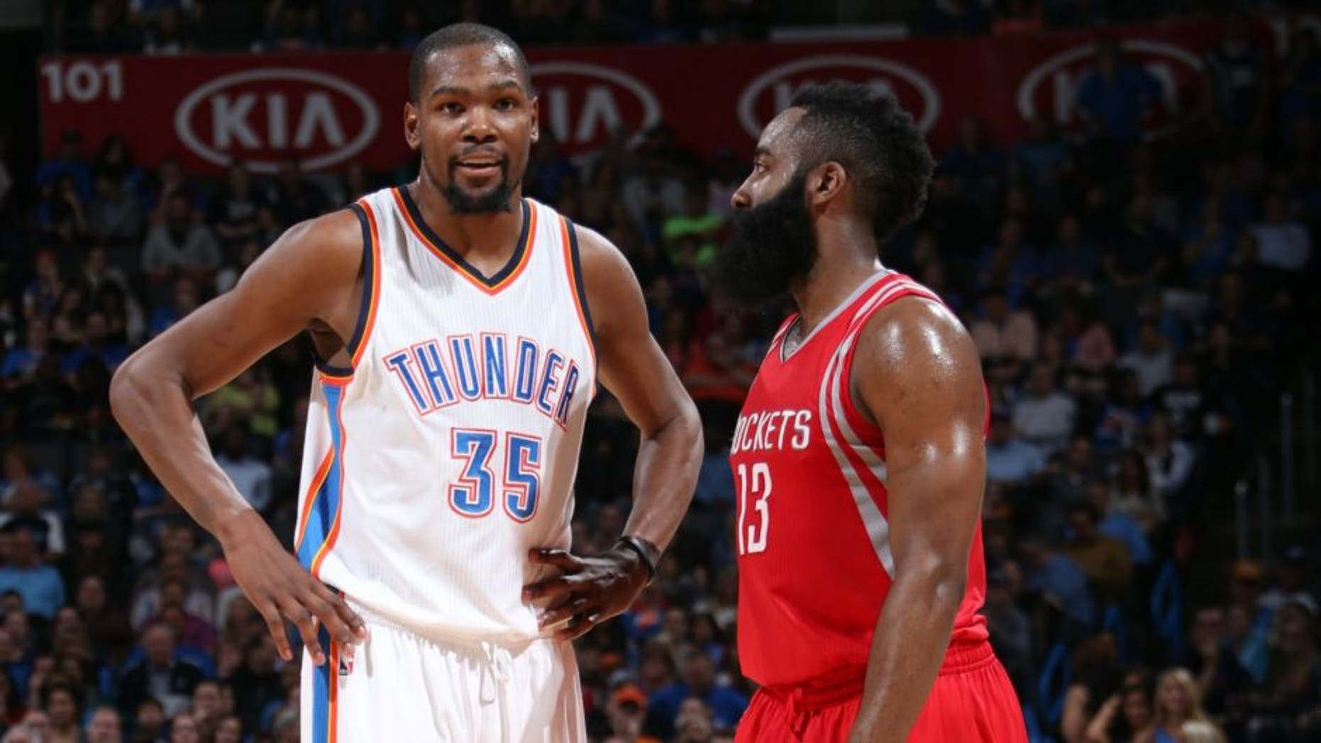 OKLAHOMA CITY, OK- JANUARY 29: Kevin Durant #35 of the Oklahoma City Thunder and James Harden #13 of the Houston Rockets talk during the game on January 29, 2016 at Chesapeake Energy Arena in Oklahoma City, Oklahoma. NOTE TO USER: User expressly acknowledges and agrees that, by downloading and or using this photograph, User is consenting to the terms and conditions of the Getty Images License Agreement. Mandatory Copyright Notice: Copyright 2016 NBAE (Photo by Layne Murdoch Jr./NBAE via Getty Images)