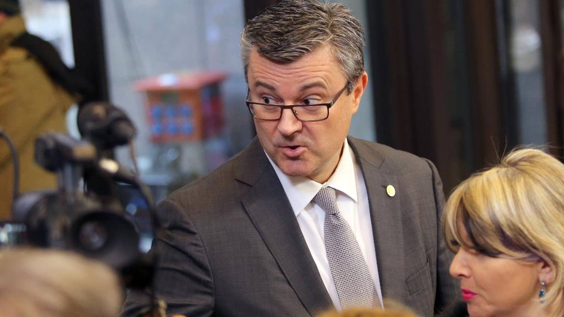FILE- In this Friday, Feb. 19, 2016 file photo, Croatian Prime Minister Tihomir Oreskovic, speaks with journalists as he arrives for an EU summit in Brussels. Croatian lawmakers were debating on Thursday, June 16, 2016 whether to oust Prime Minister Tihomir Oreskovic amid a government deadlock that has fueled prospects of early elections in the European Union’s newest member country.(AP Photo/Francois Walschaerts)