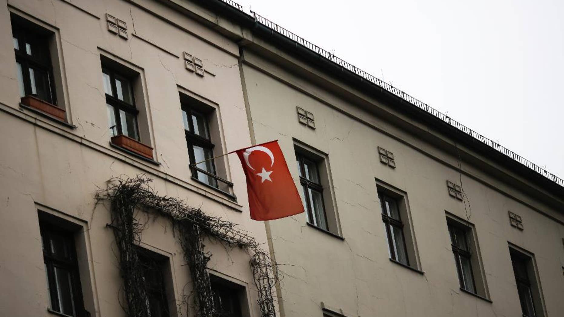 A Turkish national flag is displayed at an apartment building in the district of Kreuzberg in Berlin, Tuesday, March 14, 2017. (AP Photo/Markus Schreiber)