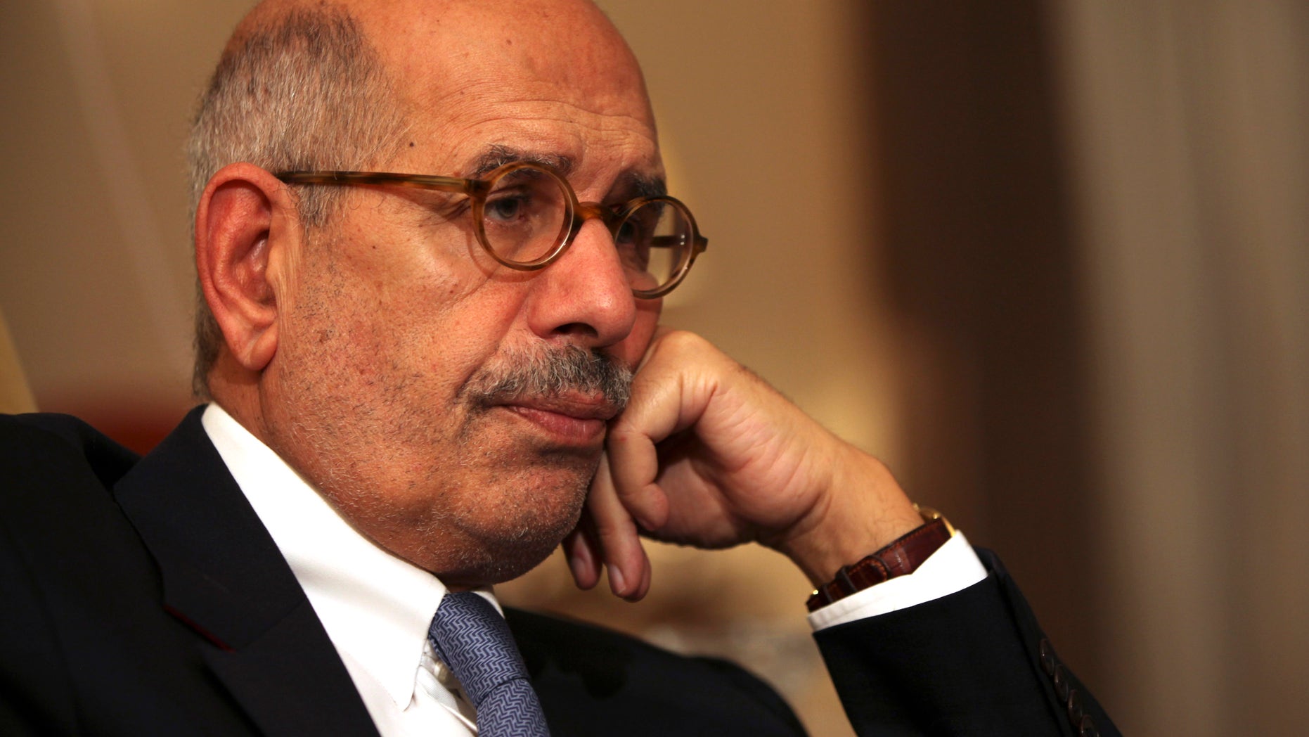 FILE - In this Saturday, Nov. 24, 2013 file photo, leading democracy advocate Mohammed ElBaradei speaks to a handful of journalists including the Associated Press, at his home on the outskirts of Cairo, Egypt. Security was beefed up around Egypt’s opposition leaders on Thursday, Feb. 7, 2013 after several hardline Muslim clerics issued religious edicts calling for them to be killed, raising fears of assassinations similar to that of a Tunisian opposition leader gunned down a day earlier. A security official said ElBaradei’s home and several other leaders’ homes will be put under observation for their protection.(AP Photo/Thomas Hartwell, File)