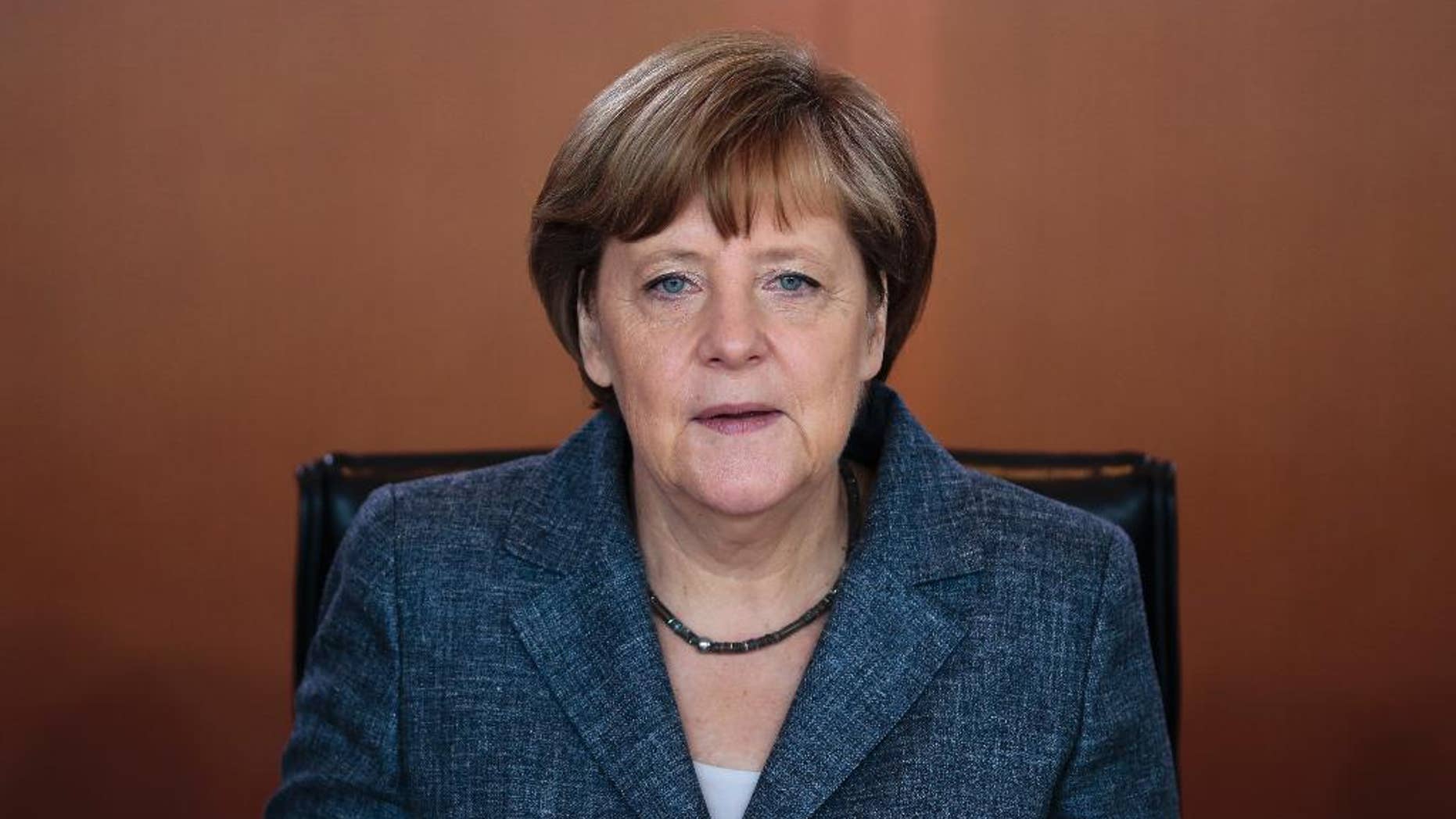 German Chancellor Angela Merkel arrives for the German government's weekly cabinet meeting at the chancellery in Berlin, Germany, Wednesday, June 3, 2015. (AP Photo/Markus Schreiber)