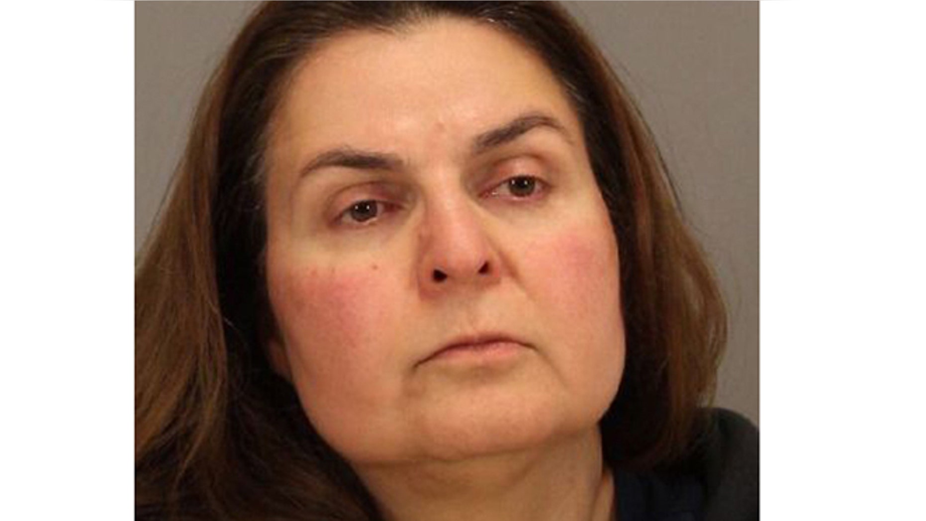 In this April 29, 2013 photo released by the San Jose Police Department is Ramineh Behbehanian, 50. Behbehanian is facing attempted murder charges after authorities say she tried to sneak orange juice bottles spiked with rubbing alcohol inside a Starbucks.