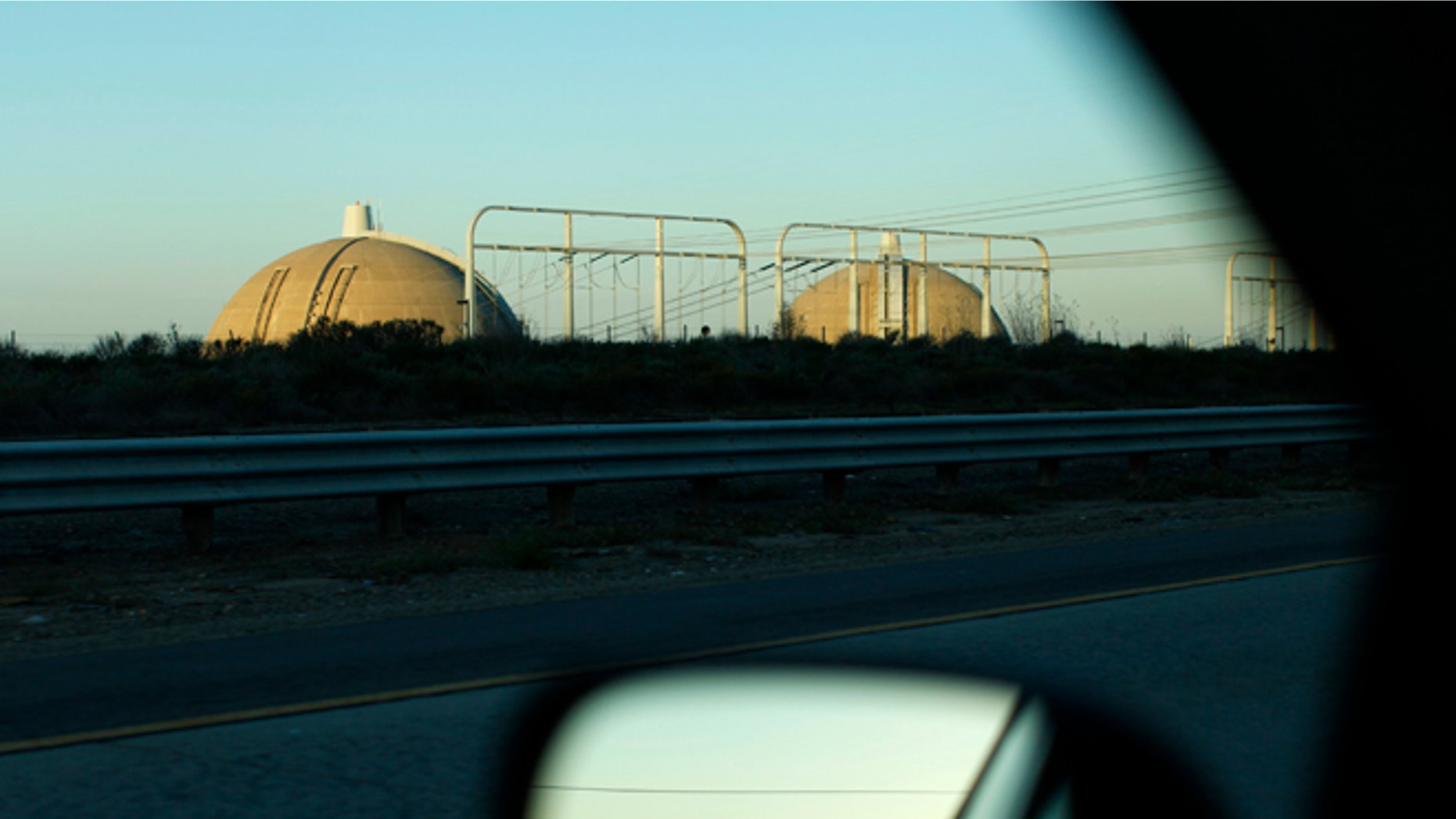 February 23, 2013: The San Onofre Nuclear Generating Station is seen from a car driving along Interstate 5, north of San Diego County near San Clemente, California.