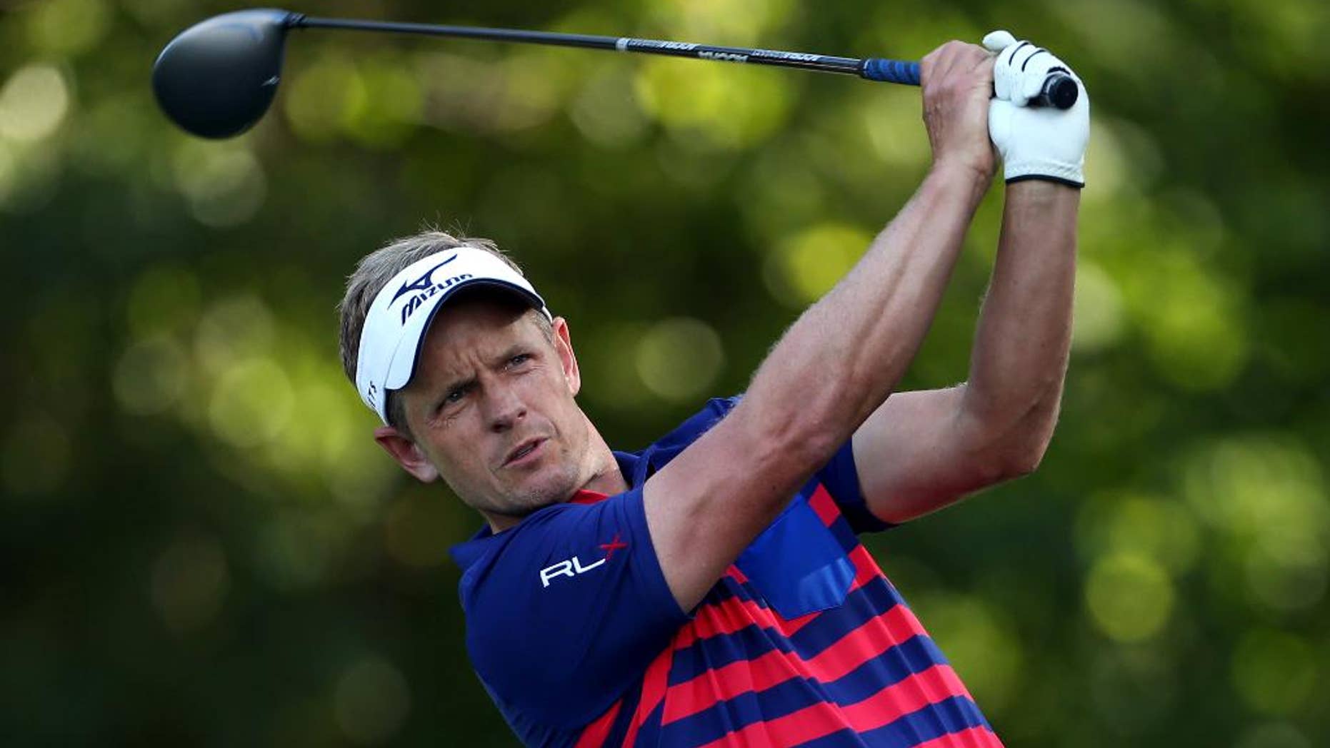 Luke Donald, of England, tees off on the fifth hole during the first round of play at The Barclays golf tournament Thursday, Aug. 27, 2015, in Edison, N.J. (AP Photo/Adam Hunger)
