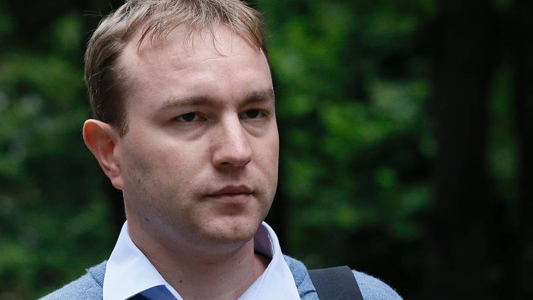 FILE - This is a Monday, July 27, 2015 file photo of Tom Hayes as arrives at Southwark Crown Court in London, Monday, July 27, 2015. A British jury found former Citibank and UBS trader Tom Hayes guilty of being the ringmaster in the manipulation of a key interest rate, the London Interbank Lending Rate, or Libor. The jury on Monday Aug. 3, 2015 found 35-year-old Hayes, who specialized in products pegged to yen-denominated Libor, guilty of manipulating the rate from 2006 to 2010. He was charged with conspiring with other traders — but he says he was made a scapegoat for a common practice. (AP Photo/Kirsty Wigglesworth, File)